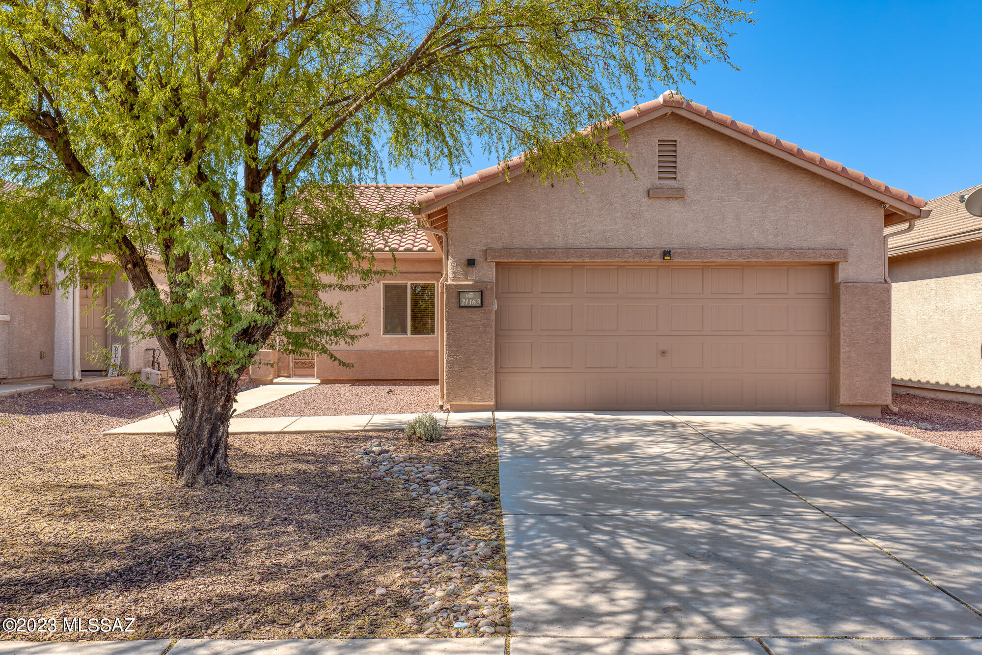 Pride of ownership shines in this Red Rock gem. This contemporary, low maintenance home is move-in ready! Come enjoy the plethora of amenities Red Rock Village has to offer: two pools, skate park, basketball court, baseball fields, playground, volleyball, clubhouse - Red Rock has it all! Ceramic tile in all living spaces, fresh carpet in the bedrooms, washer, dryer and all appliances convey. No rear neighbors, backs to walking trail. Come enjoy the good life just a short drive from Tucson!