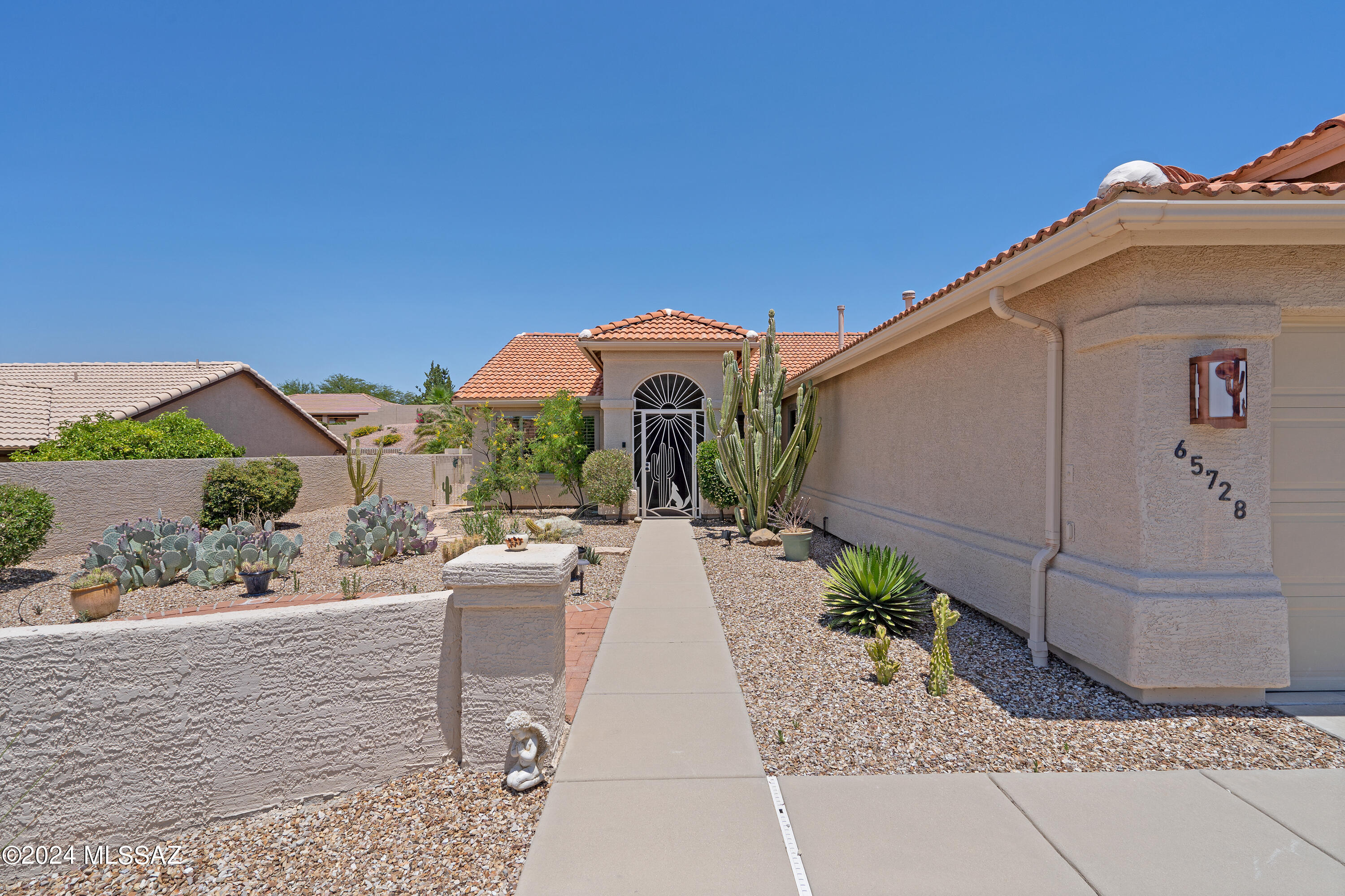 Step inside this beautifully updated Diego model that includes 2 bed+den and office/hobby room off garage. Gorgeous kitchen with newer cherry cabinets, granite countertops w/ custom tile backsplash, s/s appliances & large s/s farm sink. Primary includes remodeled en-suite bath w/ double vanities, granite & glass shower enclosure. Remodeled guest bath and built in murphy bed in secondary bed. Tile floors in main areas, newer windows, plantation shutters, and lots of natural light. Relax in the screened in Arizona room overlooking the tranquil backyard or enjoy a cup of coffee on the front patio capturing mountain views. Extended garage incl. utility sink & built-in storage cabinets.  HVAC and Water Heater installed in 2020 & whole House Air Scrubber installed in 2022. This home is perfect!