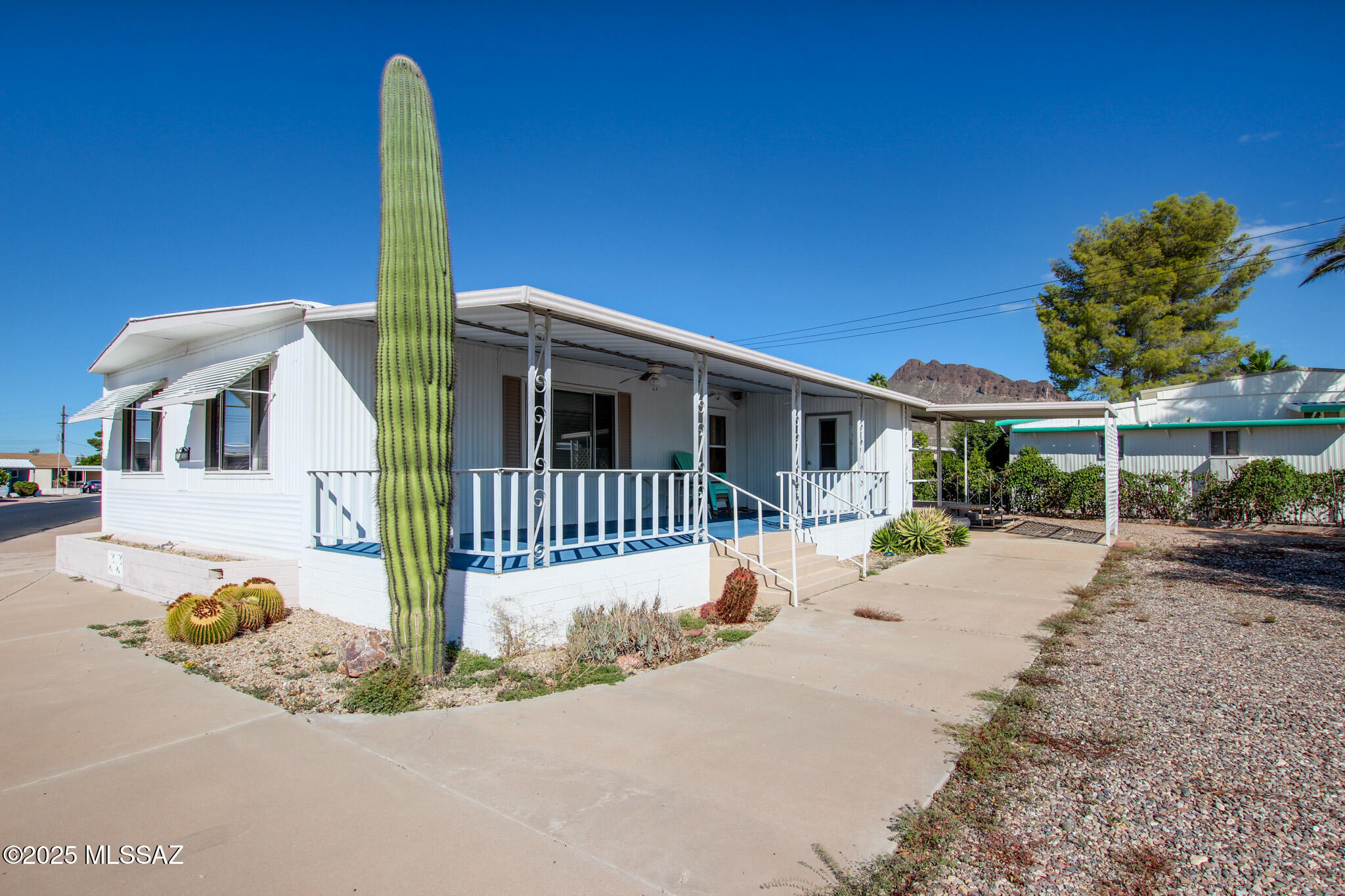 Come see this charming 2 bedroom, 2 bath home with 1,440 sq ft of living space, located in the desirable 55+ Tucson Estates community. This residence offers a comfortable layout, great veiws, covered parking, and room to create your ideal outdoor retreat. Living here means enjoying a true resort-style lifestyle with amenities that include golf, pickleball, tennis, swimming pool, spa, clubhouse, fitness center. Nestled against the scenic Tucson Mountains this home is the perfect blend of comfort, convenience, and community!