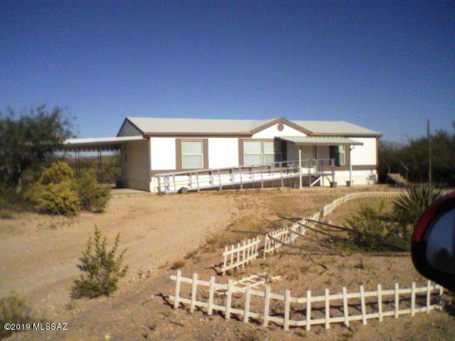 Nice home off paved road on almost 5 acres with carport. Washer and Dryer included. Water included.