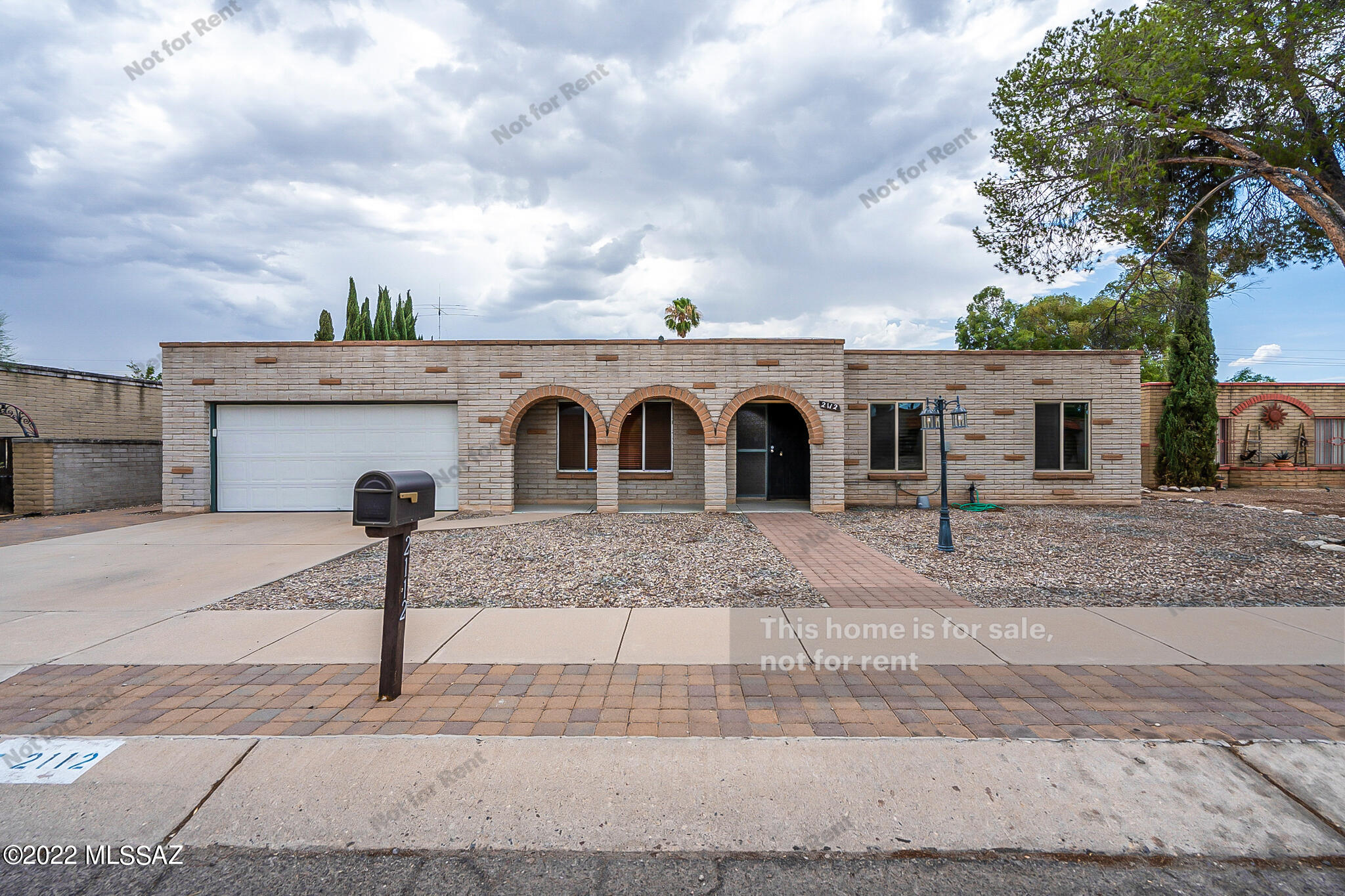 Your dream home is waiting for you in Tucson! This charming 3 bedroom, 2.5 bathroom with 2 car garage home is now on the market! The kitchen boasts generous granite counter space, stainless appliances, beautifully accented olive cabinetry and a central island with breakfast bar as well as stunning overhead light fixtures, making cooking and entertaining a delight.  Flow into the living space, complete with cozy fireplace, perfect for curling up on the couch with a good book!  Lighting and fixtures welcome you further into to the home and towards the bedrooms.  The main bedroom boasts a private ensuite bathroom with dual sinks and let's not forget about the walk-in closet. This homes drought resistant front yard makes maintenance a breeze while the large fenced in backyard is waiting to be