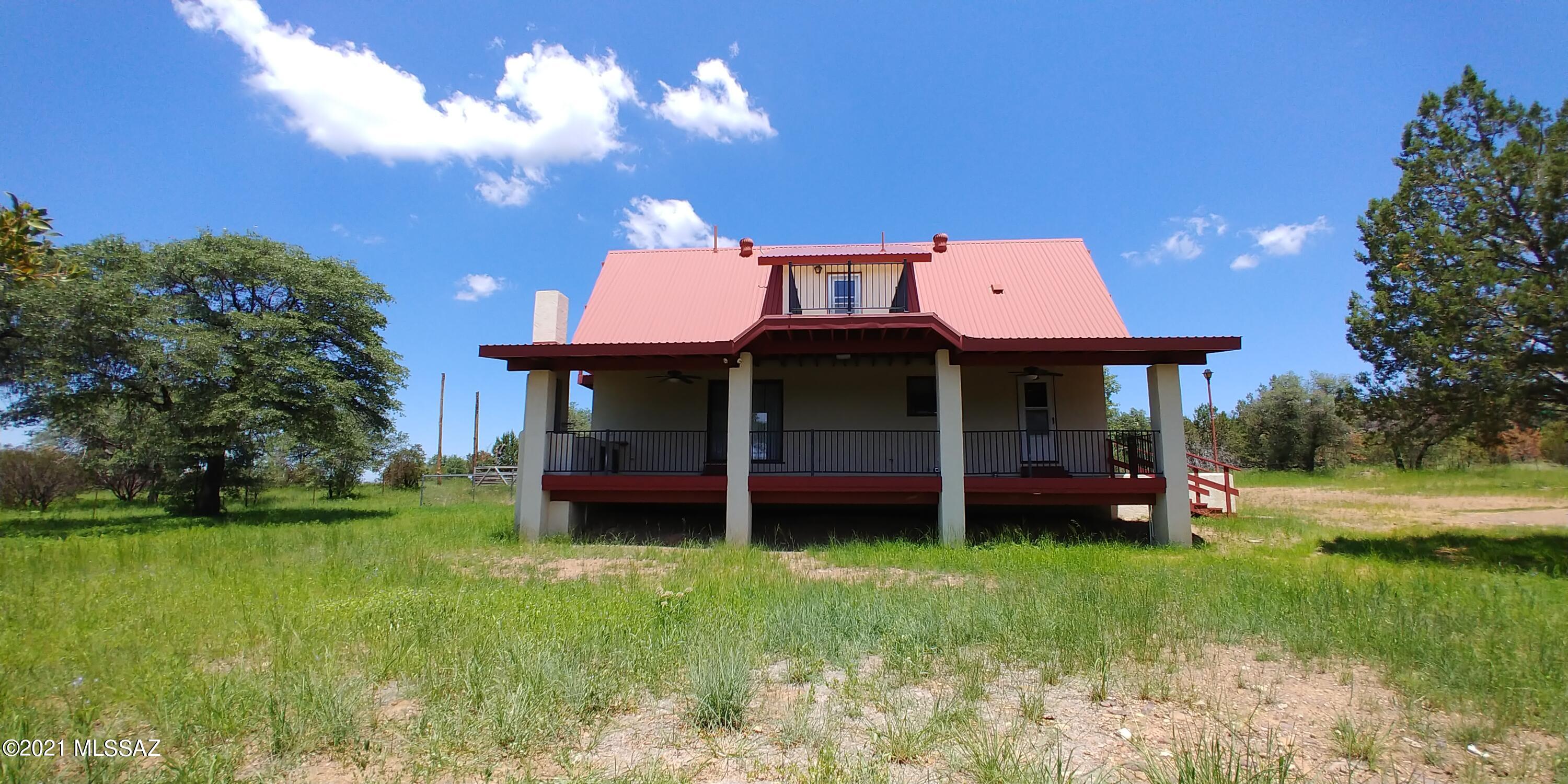 Here is a rare find! This home is in the highly desirable area of Lyle Canyon and is close to National forest and Parker Lake. Just a short drive to Ft Huachuca for shopping, restraunts and more. The views are gorgeous in every direction. The home has 2 stories plus a full basement. The kitchen has been updated with beautiful oak cabinetry  and there is ample storage. There are patios on the front and back to watch all the deer go by. There is a studio guest house with wood stove as well as a large quanset style detached shop with a large roll up door and a separate man door with workshop area. You will not want to miss this great property!