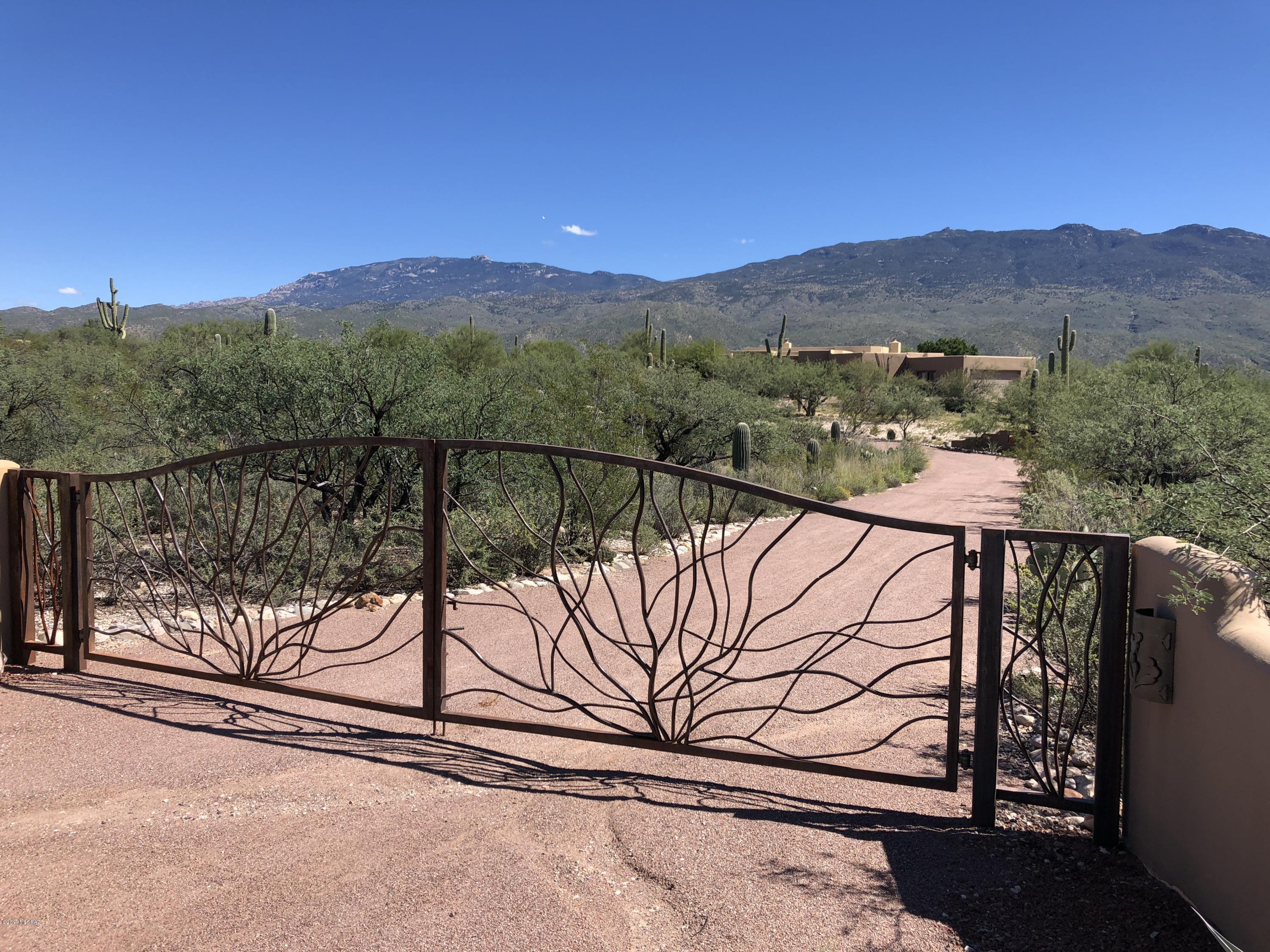 Fabulous SOUTHWEST COMPOUND ideally located in Highly Sought out LA CEBADILLA ESTATES. 5.15 Acres with a Wonderfully Upgraded Home - 3815 Sq Ft; 4BR/3.5BA & Extended 2 Car Garage. Includes Horse Facilities (2 horses allowed) and Amazing Panoramic VIEWS. Private Gated Entry, Beautiful Courtyard w/Entry Gate. Home includes Saltillo Tile Throughout, High Plank Beamed Ceilings, Decorative Tile and Saguaro Rib Accents, Spacious Family Room w/Fireplace. Incredible Entertainer's Kitchen w/Slab Granite Counter Tops, Hand Crafted Cherry Cabinets, Built-In Refridgerator, Stainless Steel Appliances & Breakfast Nook w/Bay Window Overlooking Covered Patio. Lushly Landscaped and Gated Backyard includes: Pool & Spa, Built-In BBQ, Cozy Fireplace w/Seating and VIEWS. This is one of the finest communities in the entire East Side. Call today for a personal showing.