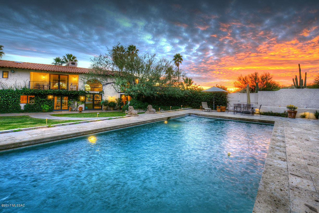 THIS EXQUISITE ESTATE HOME, OFFERS COMPLETE PRIVACY FROM OUTSIDE TO IN WITH LUSH MATURE GARDENS SITUATED ON 2.3 ACRES BEHIND A PRVATE GATE. ATTENTION TO DETAIL IS EVIDENT IN THE EXTENSIVE LIST OF CUSTOM DESIGNED FEATURES (SEE LIST IN DOCUMENTS SECTION). THE MAIN HOUSE IS COMPRISED OF 4 BDRMS & 5 BA'S, FORMAL LIVING & DINING RM, 3 FRPLS, GOURMET KITCHEN W/ MIELE/SUBZERO APPLIANCES, SEPARATE FAMILY RM, 3,000 SQFT ANCILLARY BUILDING OFFERING CAR BARN GARAGE/RV/EQUIPMENT/OVERFLOW STORAGE, ETC, 587 GUEST HOUSE WITH PRIVATE ENTRY, EQUIPPED W/ KITCHENETTE. THE EXPANSIVE GROUNDS ARE PERFECT FOR ENTERTAINING, OVERLOOKING THE SPARKLING, SUN FILLED POOL & SPA, SURROUNDED BY LUSH GARDENS & MTN VISTAS BEYOND. HOME IS SERVICED BY BOTH A PRIVATE WELL & CITY WATER, WITHIN WALKING DISTANCE TO SABINO CANYON