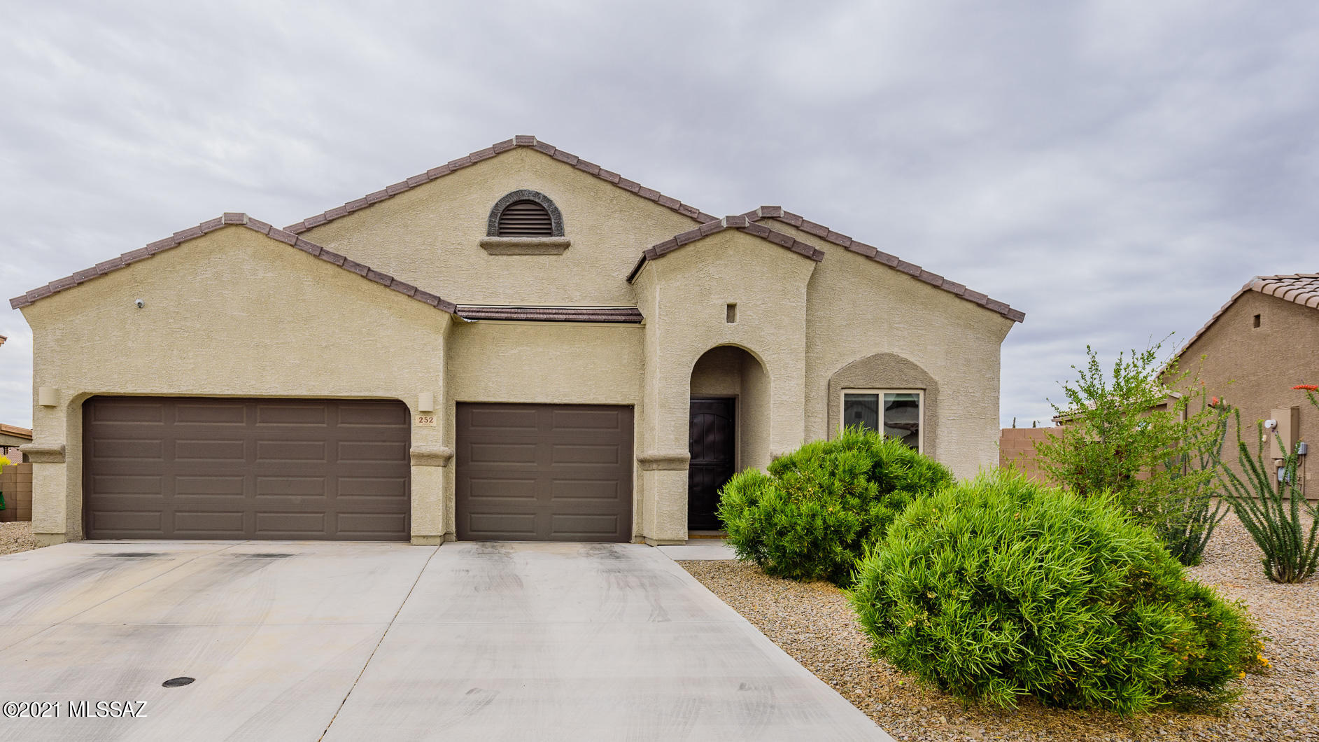 Seller will accept or counter offers between $350,000-$385,000. Beautiful D.R. Horton Home Built in 2018 - Cypress Floor Plan. Located in the Award Winning Vail School District! Property includes 4 bedrooms / 2 bathrooms / 2,172 SF / 3 car garage. Tiled throughout with carpet in bedrooms. Two-tone professionally painted throughout (Nantucket Dune / Dover White). 6'' x 24'' wood-look tile. Front security screen door. Ceiling fans in every room including the library off of the entrance. Custom built-in entertainment center in the family room. Structural upgrade of raised ceilings throughout property including the garage (10 ft 1in.). 5 raised panel interior doors. Security camera system to convey with sale of property (2 cameras in front / 2 in back). Spacious laundry room with upper cabinets (pre-plumb laundry sink). Garage includes storage racks for convenience. Garage is also pre-plumbed with the soft water loop. Kitchen highlights: Upgraded SS appliances, gas range, granite, white shaker style cabinets with staggered uppers, pendant lights above the island, walk-in pantry, & under-mount double bowl sink. Master suite includes a dual vanity and walk-in shower. Exterior features: Covered backyard patio with pavers (approx. 600 SF of pavers). Pergola conveys with sale! Approx. 900 SF of grass in backyard watered by a low maintenance subterranean irrigation system. 8 ft double gate on the W side of property.