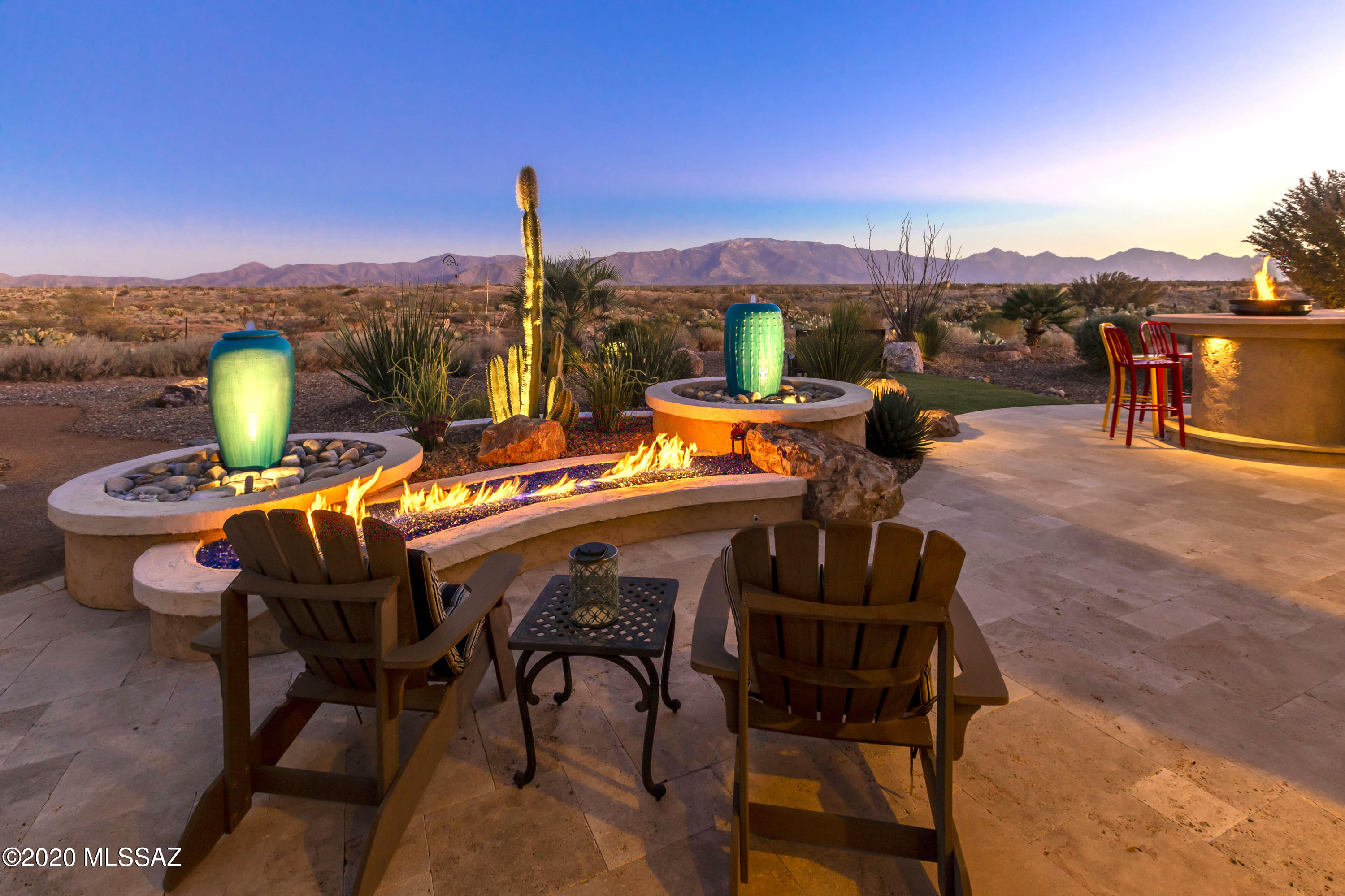 You will be delighted with this BRISA model w/full panoramic mountain view. Too many top-of-the-line features to list. Some of the attention to detail upgrades include *Elegant Kitchen w/high end Miele appliances, granite countertops, full backsplash, island and breakfast bar, upgraded pendant lights, a cabinet pantry, walk-in pantry & valet *Large built-in wine cooler & feature wall w/stone accents in Great Rm *Built in bar/buffet in Dining *Morning Rm w/fireplace, stylish stone decor, and built-in cabinetry *Large Owner's Suite w/En-suite Bath featuring curbless shower & generous walk in closet w/ organizers *A/C cooled insulated extended 2 car garage and golf cart storage, over height doors *Generous travertine patio w/ two firepits, hot tub, rolling shutters. So much more!