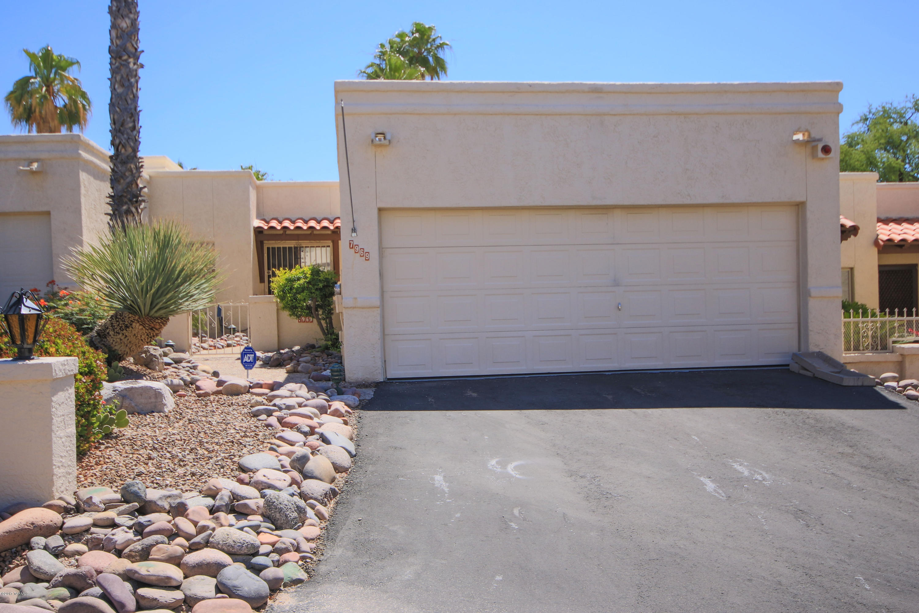 Intriguing townhouse located in the desirable Northeast area! This townhouse features 2 bedrooms, 2 baths, a large kitchen pantry, ceiling fans throughout as well a the central vacuum, alarm, and its own private entrance to the community pool! The backyard has an added Arizona room allowing for additional privacy and great mountain views! This is a must see!