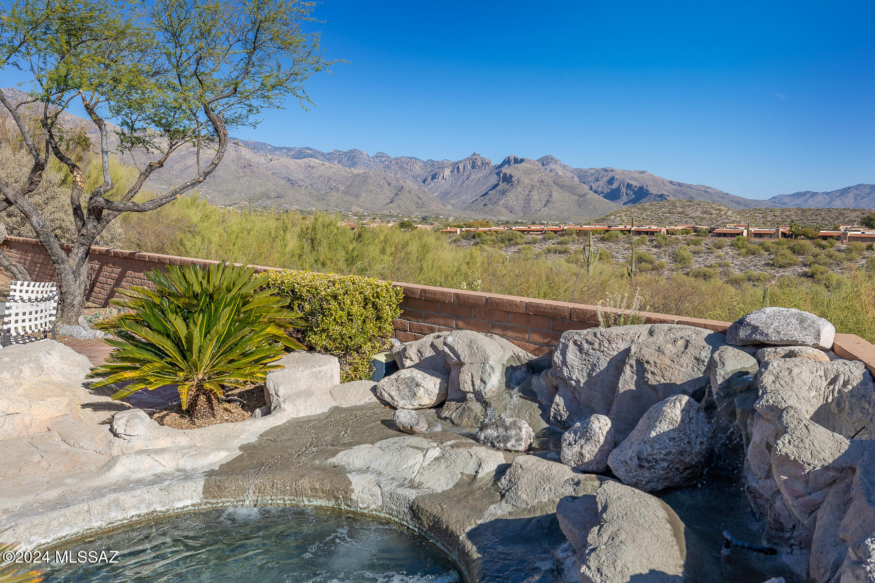 Spacious move in ready Mazatlan floorplan, spectacular Catalina Mtn, Rincon Mtn & east valley views. You will love the views from both inside and out. Extremely light & bright w large windows & skylights, high vaulted ceilings, remote blinds. Remodeled kitchen w/large peninsula for family eating & entertaining. Maple slab cabinets, granite counters, appliances, more storage than you can possibly fill! Extra room currently used as storage - could be additional office area. Poly pipes were replaced. This home is in what some call the ''sweet spot'' on the street w/fabulous views but far away from any noisy main roads. Community has 2 pools/spas, tennis courts & clubhouse. Very active community w/lots of opportunity to mingle with fellow neighbors. Welcome Home to Fairfield!