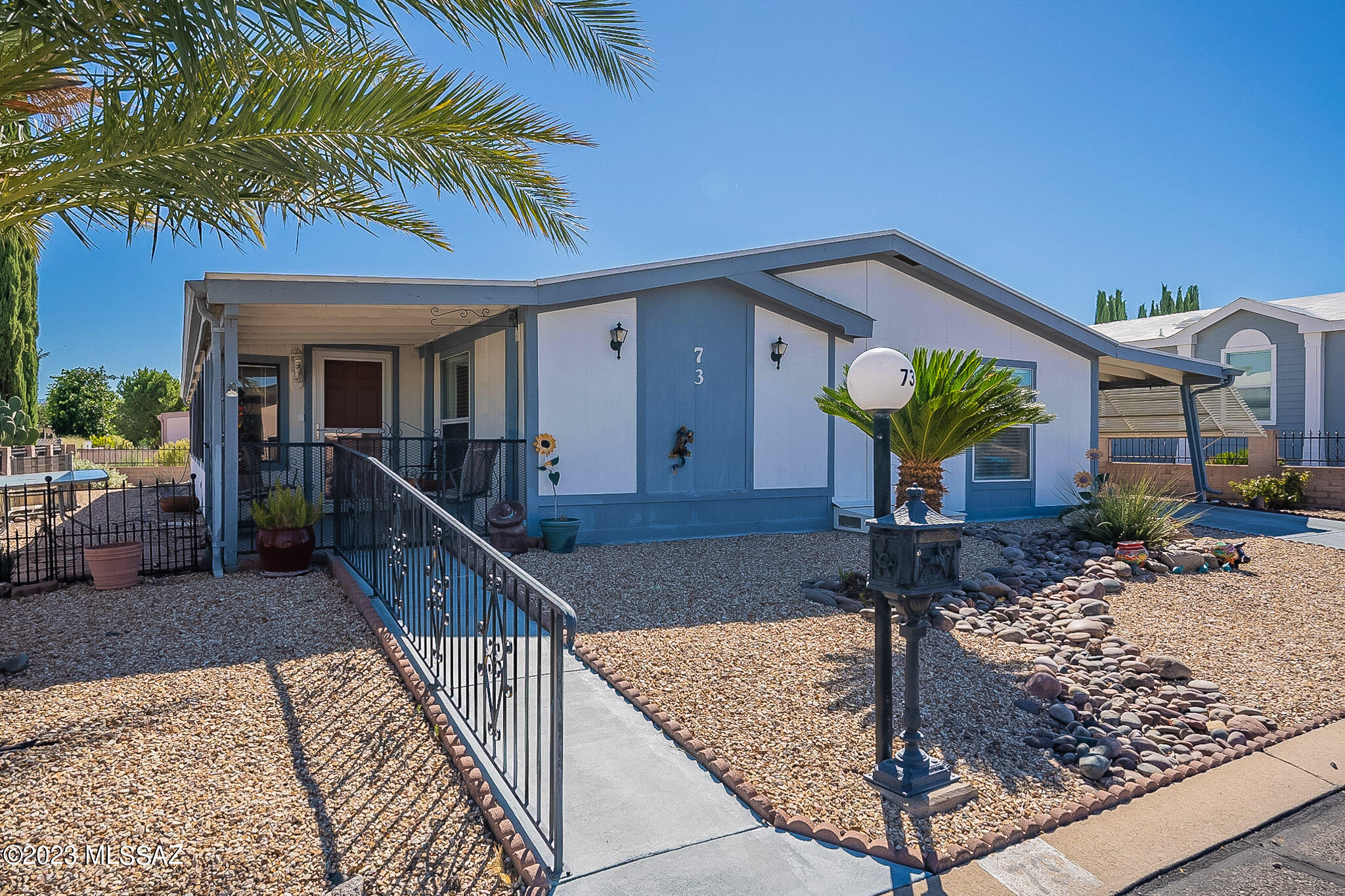 Beautiful, well cared for home in Pueblo Estates.  Nice updates which include new furnace, stove, carpet, microwave, light and more that are listed in the documents section.   Fenced back yard and workshop that has a garage door to house a golf cart (if wanted).  So much to this house and it comes fully furnished!  Everything inside the home (except for a few items marked) stays with the home.  Easy living and to top it off NO GVR.
