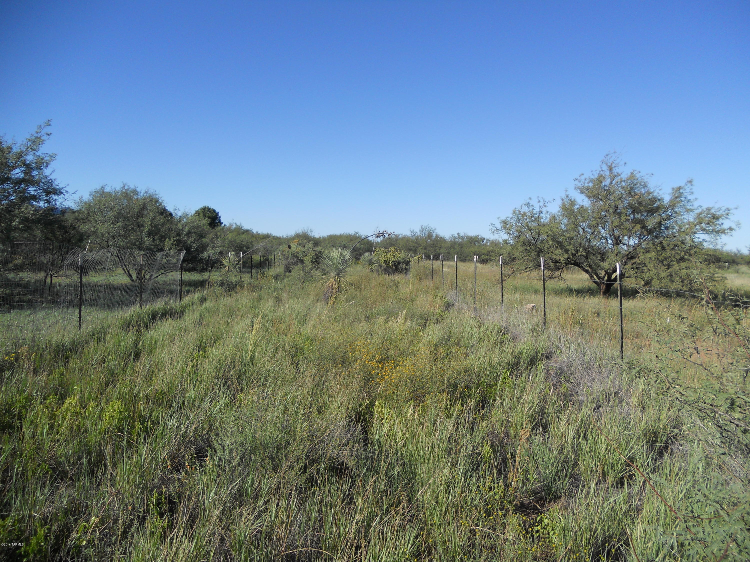 This is a nice flat piece of land at the end of the road.  Owner had a well drilled that is capped and ready to be put into use. Utilities are at the property line which makes it ready for your site built or manufactured home. there is plenty of space for horses, workshop and garden and you will still room to roam. Gorgeous views of the mountains.