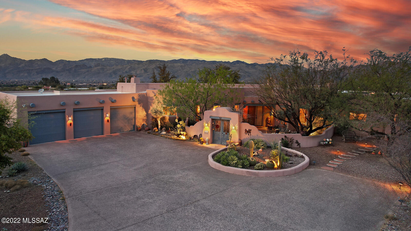 Authentic Ray Birch Santa Fe in beautiful Wild Horse Ranch. Exterior finish: paint over 3 coat stucco finish. Interior:  Imperial plaster finished walls, four kiva fireplaces, Saltillo tile floors in all public space. Ceiling details:   saguaro rib latillas,  skip peeled led log Vigas, and coved plaster barrel details. Illuminated niches throughout.  Decorative Talavera tile in guest bathrooms.  Exterior features: wrap around patios, waterfall/pond,  lap pool with auto cover and expansive Catalina and Rincon views all on a 3 plus acre lot within gated Wild Horse Ranch Community. Close to Saguaro National Park East.