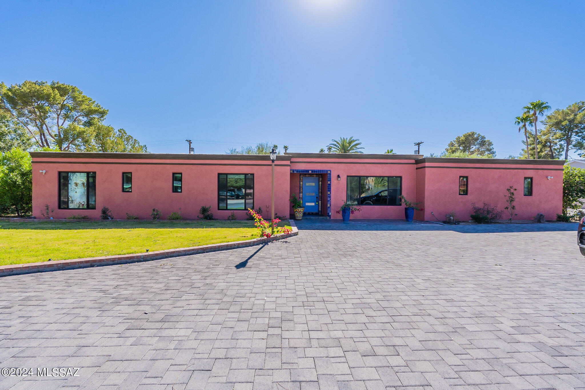 Located in the gorgeous, gated community of Tucson Country Club. The community has an abundant number of amenities including pools, tennis courts, pickleball, and fitness center just to name a few. This spacious home has been remodeled throughout with neutral, bright details. In addition to the main house is a true guest quarters complete with its own private entrance, full kitchen, living room, laundry and bedroom suite. Perfect for multi-generational living, extra space for company, children's wing, or any number of uses. The main house has a large chef's kitchen, separate dining area, open concept, two living rooms, 2.5 baths, and large master bedroom. Each of the guest bedrooms boast plenty of space as well and share a Jack and Jill bathroom. Kitchen is complete with beautiful alde cabinets, natural quartz counters, two islands and smart layout. Outdoor is your our own private oasis with mature trees, grassy area, large pool and a covered patio that runs the full length of the home. Enjoy the quiet landscape that the community of Tucson Country Club offers. The location is near all the shopping and dining you care to enjoy. Full of traditional, Tucson charm this home will certainly check all of your boxes. Seller is licensed agent in AZ