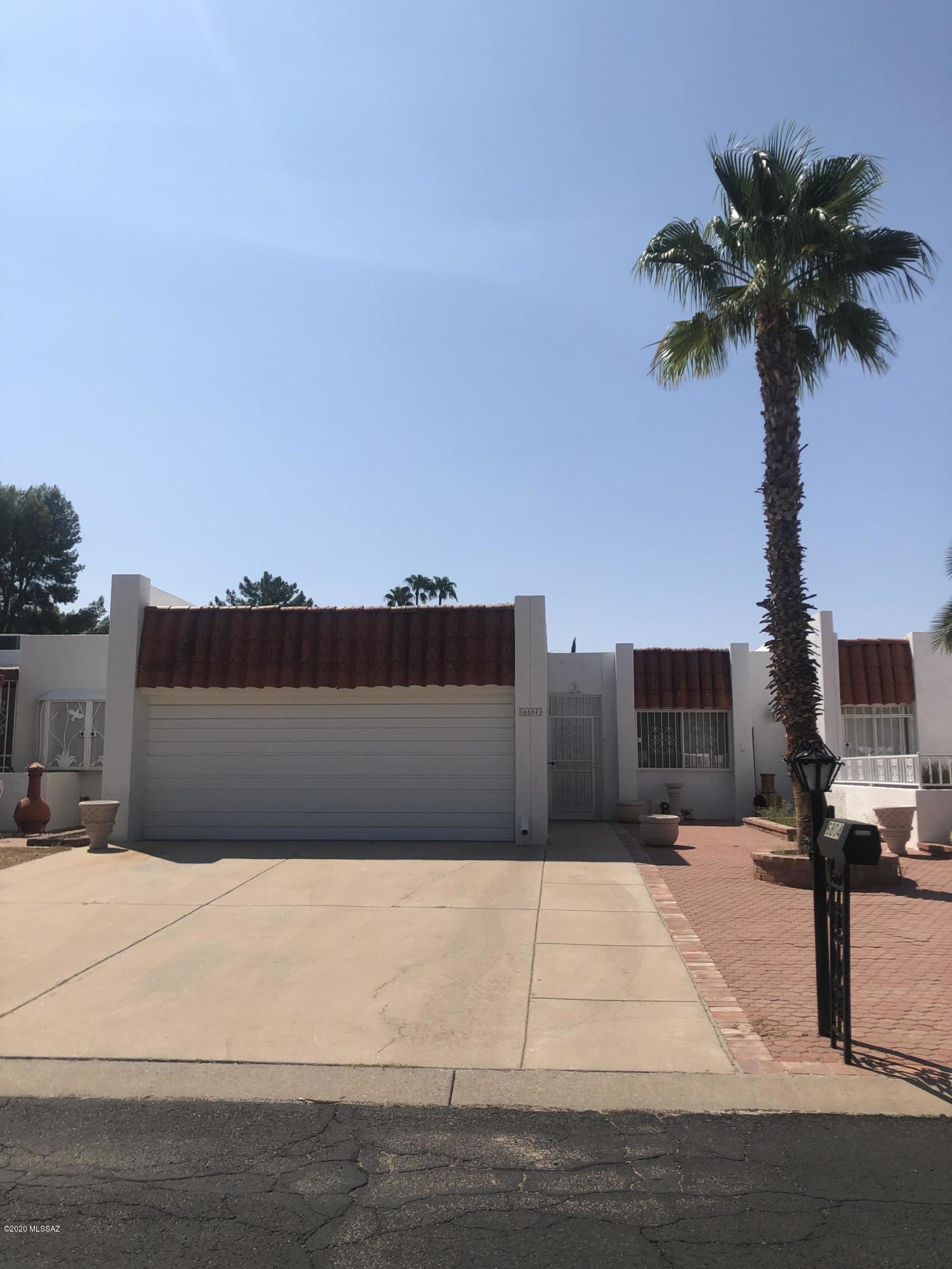 Meticulously remodeled 2BR/2BA in Dorado Country Club. Newer A/C, wood floors in living areas ceramic tile (looks like marble) in kitchen, bedrooms and baths. Wood burning fireplace in dining or family room. Gorgeous cabinetry in kitchen with granite counters. Bathrooms include marble counters and  tile shower surrounds. No popcorn ceilings either! Enclosed AZ room includes mosaic tile flooring, Extended patio with fruit trees looks out to golf course! North/South exposed also!