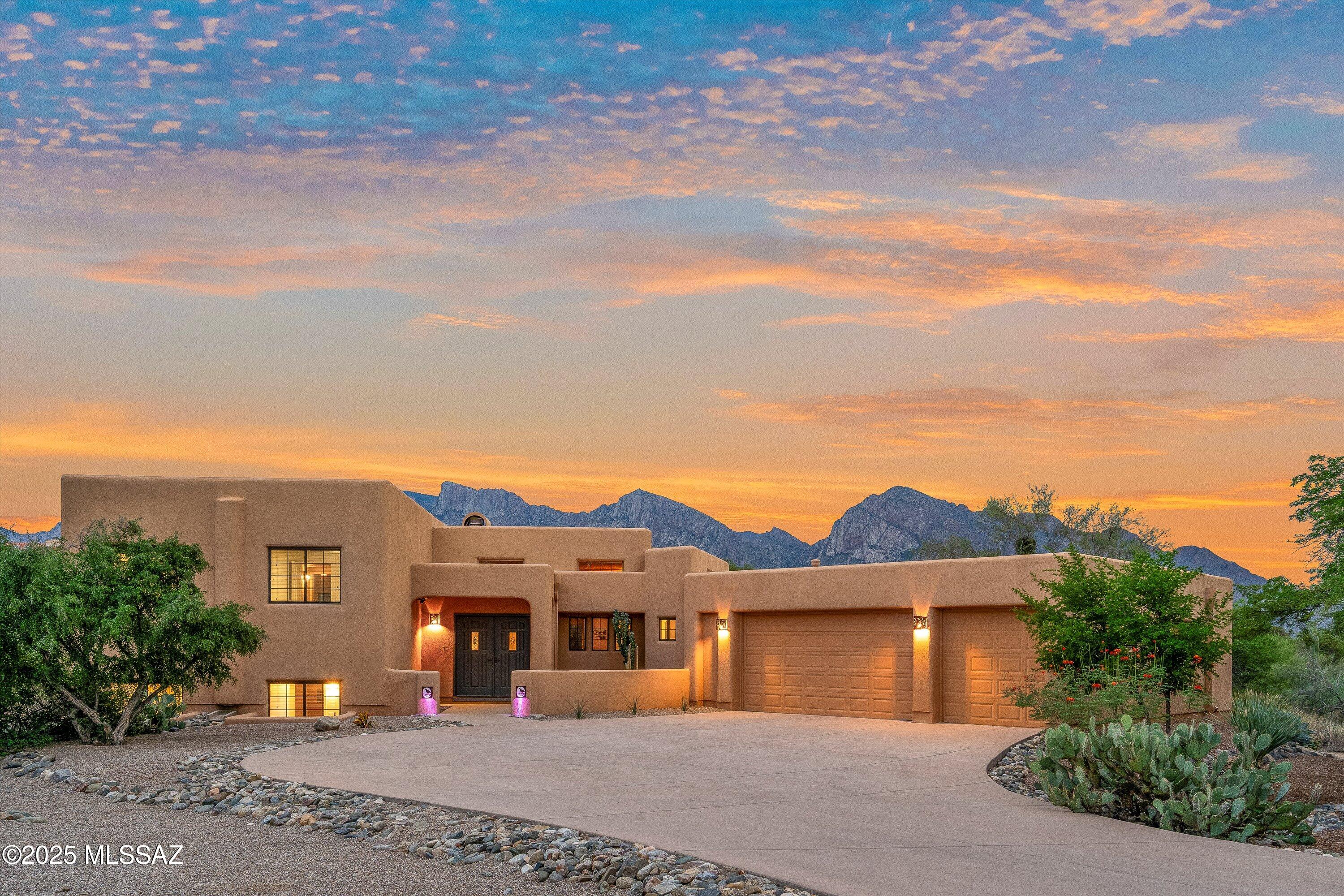 Spacious Southwestern-style split-level home in desirable Monte Del Oro with spectacular, unobstructed Catalina Mountain views! Set on a private 1.15-acre lot, this property offers the best of Arizona outdoor living with a sparkling pool, covered patio, and ramada—all perfectly oriented to capture stunning sunrises over the Catalinas. Prime location and minutes from Naranja Park. Inside, the open layout features a bright living and family room off the kitchen and a lower-level game room with wet bar, wine cooler, and beehive fireplace—ideal for entertaining. The gourmet kitchen boasts granite counters, gas cooktop, new micro/oven, stainless appliances, walk-in pantry, and breathtaking mountain views. With 5 spacious bedrooms: Owner's Suite and 2 bedrooms upstairs, plus 2 downthere's room for everyone. A 3-car garage and large storage room complete this exceptional Oro Valley retreat combining space, privacy, and views that define luxury desert living.