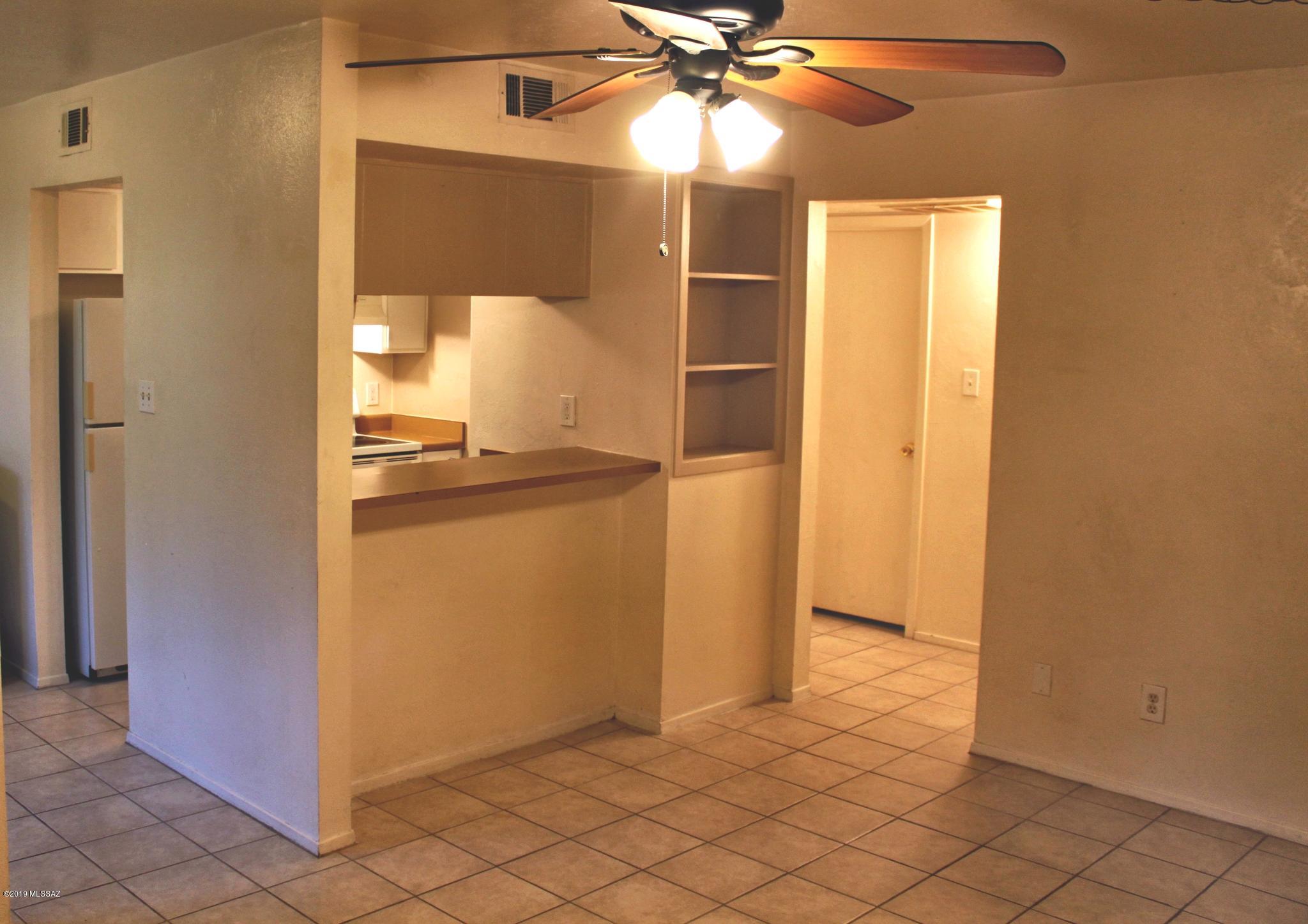 Great East Side Tucson Value. First floor one bedroom condo featuring custom wrought iron security on all doors and windows, ceramic tile throughout, double pane windows, lots of storage. New A/C unit in 2016. HOA covers water, sewer, trash 2 common swimming pools, outside maintenance, termite protection, and roof.Three assigned parking spots (not covered). One parking spot is directly in front of the front door, very convenient. HOA dues include assigned parking, cold & hot water, sewer, trash, termite control, exterior maintenance, ROOF, landscaping, and 2 community pools. On site laundry facilities with surveillance cameras, outdoor barbecue grills. Very close to shopping, hospitals, restaurants and transportation. Near ''The Loop'' which is a great area for walking, running or biking.