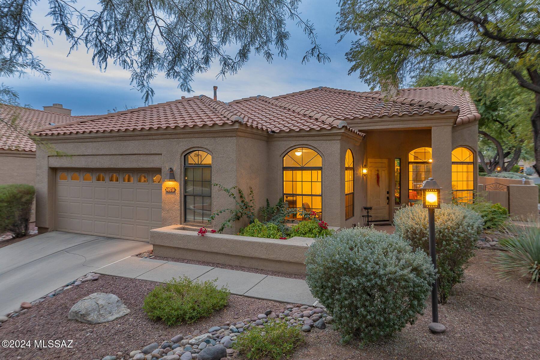 Discover the charm of this private Ventana Canyon Golf Villa, perfectly situated on a corner lot with breathtaking mountain views. Offering 2,171 sq. ft., 2 bedrooms, 2 bathrooms, and a versatile den/office space, this home provides the perfect blend of comfort and sophistication.

Inside, enjoy high vaulted ceilings, elegant arched windows, and low-maintenance tile flooring in the main living areas. The refreshed kitchen shines with modern cabinetry, beautiful granite countertops, and top-of-the-line KitchenAid stainless steel appliances, accompanied by a cozy breakfast nook. The open and spacious floor plan includes a formal dining area and a welcoming family room with fireplace, ideal for entertaining. The primary suite is a haven of relaxation with double cedar-lined closets, a luxurious soaking tub, and stylish cabinetry. Outside, the covered patio opens to a lushly landscaped backyard with built-in BBQ, offering a tranquil retreat surrounded by nature.

Located on a peaceful cul-de-sac and just steps from the community pool, this villa embodies desert living at its finest.
