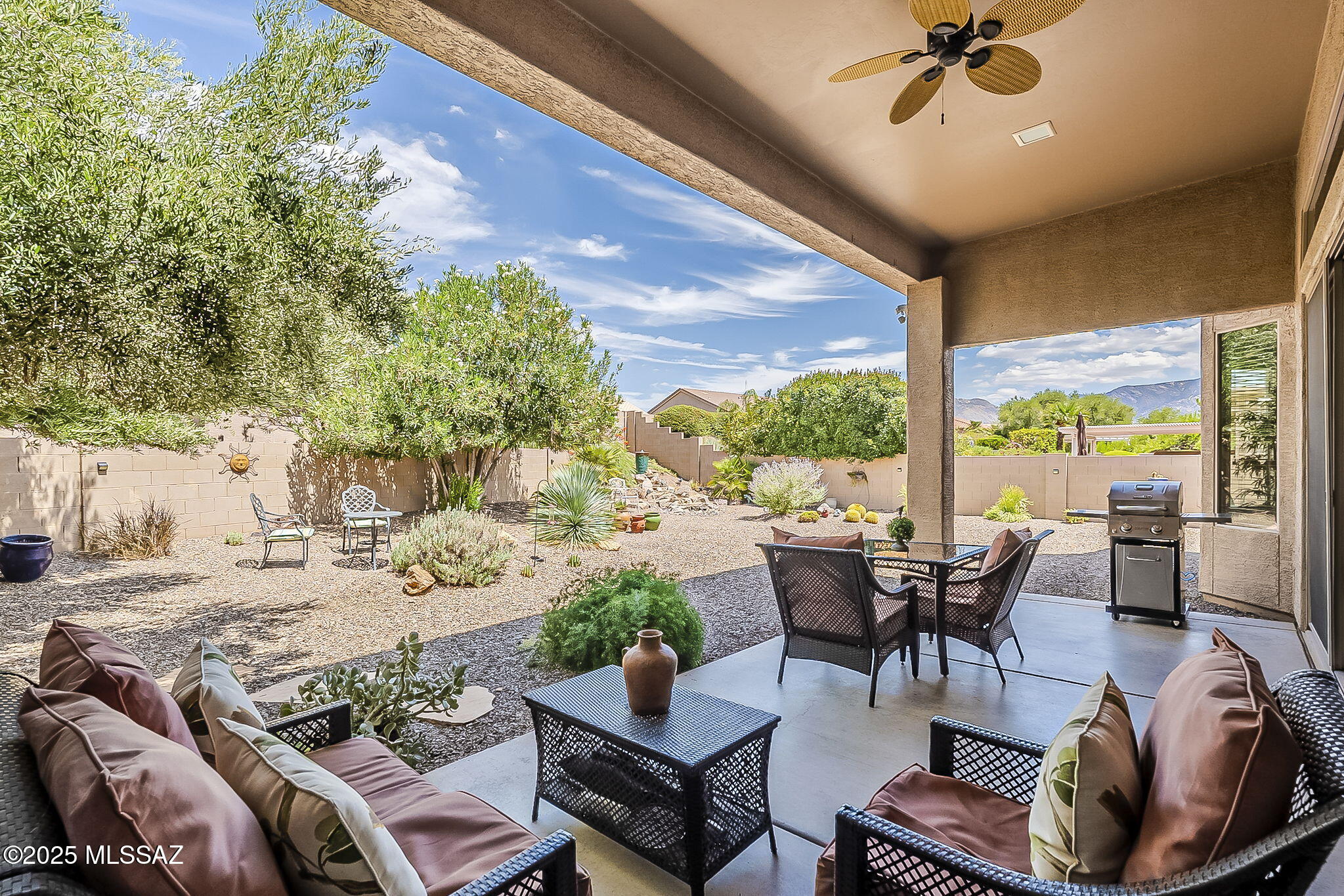 Large quiet corner lot w/private yard, side mtn views, CHEYENNE model offers space, style, and flexibility. Gated front entry w/fountain welcomes you. Bonus fitness room - CONVERTIBLE to GOLF GARAGE with seller credit.  Entertainer's kitchen shines with GE Cafe© SS appliances, quartz counters, island, wet bar, and open to family room w/gas fireplace and options for TV location. A contemporary stacked rock wall w/electric fireplace highlights the living room. The primary suite features dual closets, dual vanities, soaking tub, walk-in shower, & spacious bedroom. Split floor plan includes 2 guest rooms plus bathroom. Office/den at the front of house. Extended garage w/cabinets, large laundry, powder room, 18'' tile flooring thru living space, and carpet in bedrooms complete this gem.