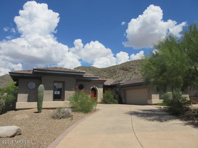 This is a beautiful home in a Dove Mountain gated community.  Not far from The Gallery Golf Club and also the Heritage Highlands & the Ritz-Carlton Resort.  This is the perfect property for entertaining!  The home has a beautiful entry way with a towering ceiling.  The great room is made up of the living room, a wet bar and a dinning area with a wall of windows facing to the Tortolita Mountains.  The kitchen is ready for that chef in your family.  Every bedroom has its own bathroom & the master bedroom suite features a large garden tub & spacious walk in shower.  The backyard boasts a large swimming pool & hot tub, BBQ grill & of course a great mountain view.  Online bidding begins 10/31/15 and ends on 11/04/15.