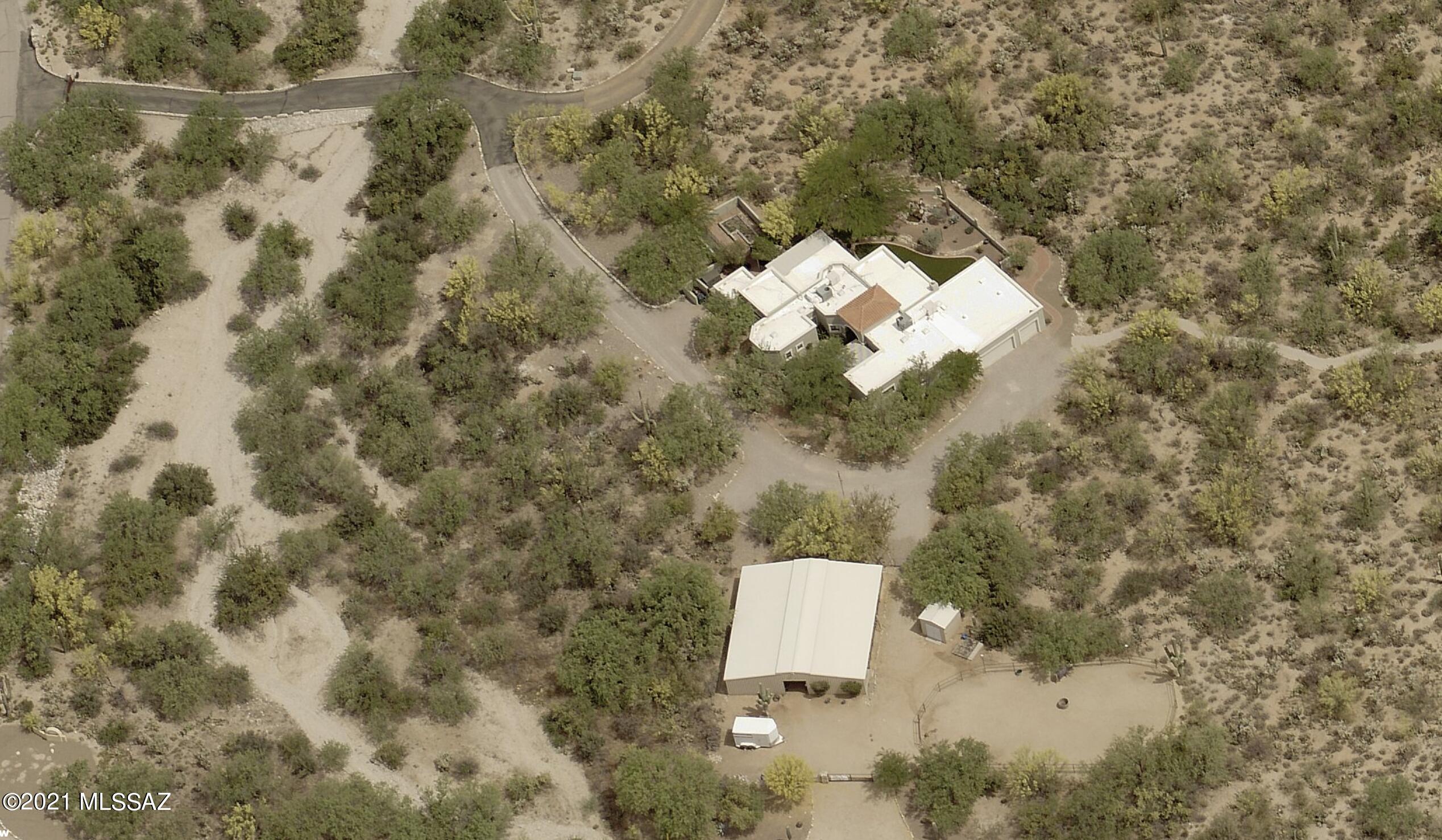 Tanque Verde Valley - Majestic Mountain View Property, with well appointed contemporary Santa Fe style home and modern horse facilities on 3.36 AC.  Iron entry gate with stone columns and long driveway constructed of show quality custom rock work.  Lush desert greenery surrounds this one of a kind home, located east of Catalina Highway along Snyder Rd. Don't miss this opportunity!