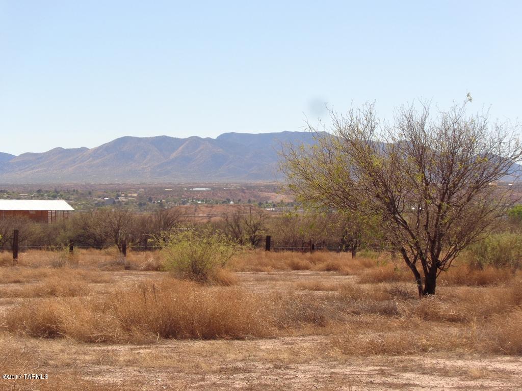 Very nice corner lot. Fenced. Power across from SE corner. Water valve box at lot edge. Pomerene Water. Come build your dream home. MFH allowed and Frame built. Great horse property. Lots of privacy. Close to I10 but not too close.