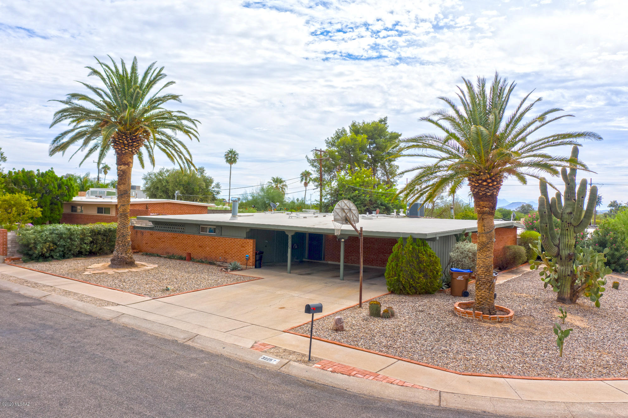 Welcome Home. This 3 bedroom 3 bath home awaits its new family. New flooring and freshly painted adds to its appeal. The kitchen with a breakfast bar opens to family room with a Kiva Fireplace, ready for Tucson winter evenings. The living room/dining area opens to the Arizona Room. Such great space. Storage is never an issue as both inside and out there is plenty of room. Close to shopping, restaurants and schools and doesn't get better. Did I mention close to the Interstate.