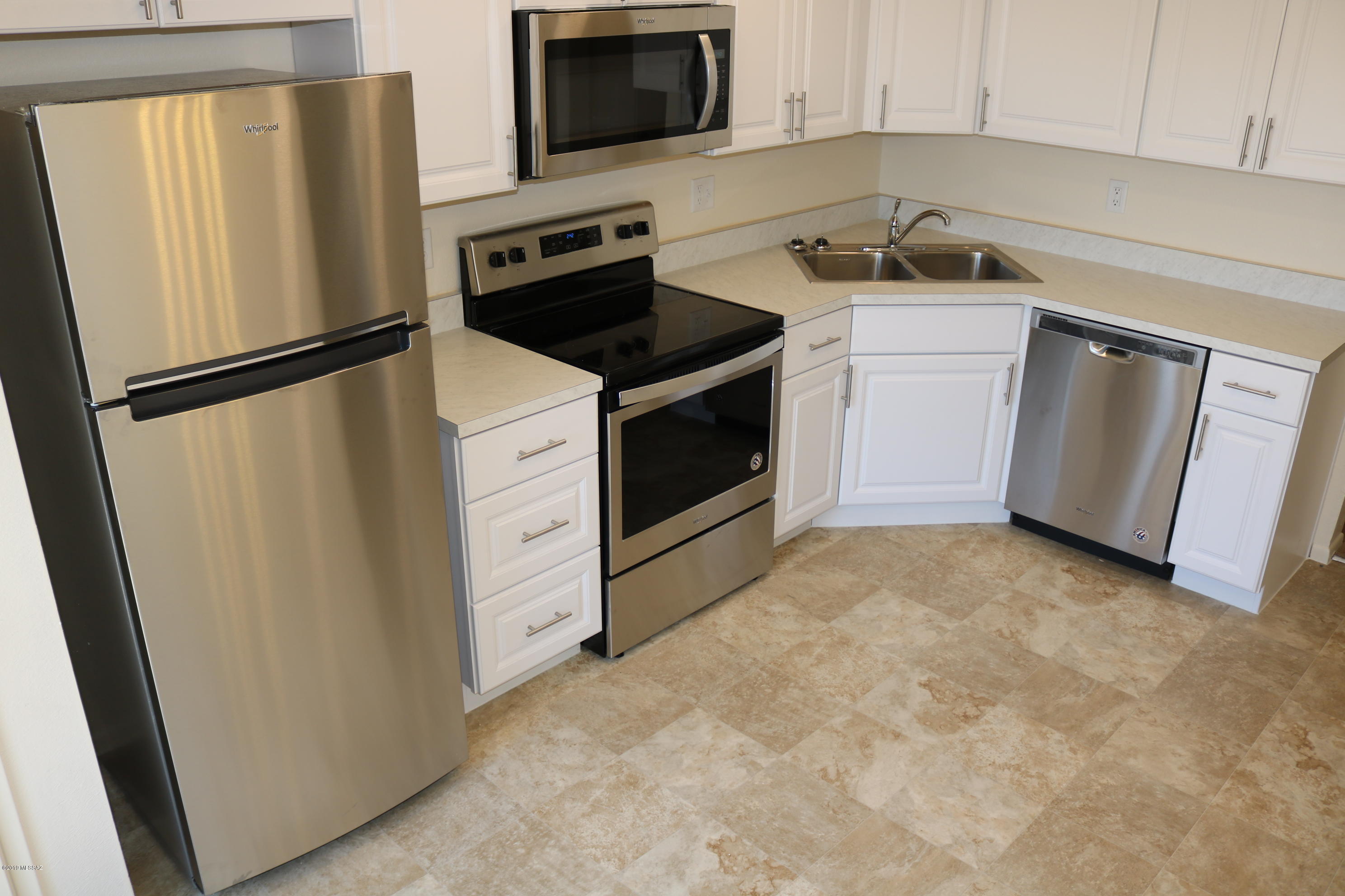 **Tenant Occupied | DO NOT disturb** Updated lovely 2 bedroom, 2 bath condo.  Located close to U of A , Pima College and Downtown! Nice floor plan! Living room, kitchen, laundry room and 3/4 bath Downstairs. Upstairs features 2 large bedrooms, and full bath. Washer/Dryer included. Mountain views from the North bedroom. Patio area off the kitchen. Perfect for Quiet  evenings with friends. Enjoy the nearby pool and spa. Covered parking space included.