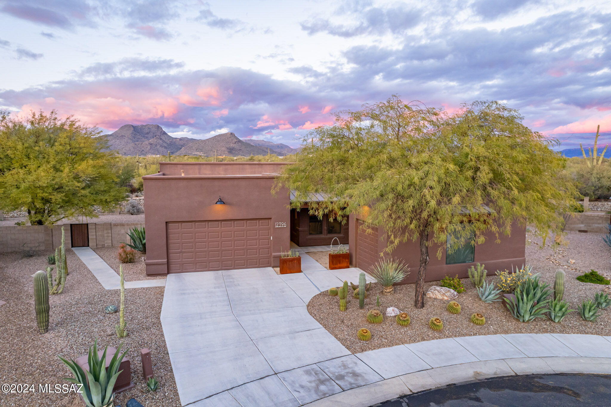 Tucked in a cul de sac in the gated Preserve at Dove Mountain, 12396 N Meditation Drive awaits. Situated on a large pie-shaped lot with designated open space behind, the property offers unobstructed mountain views and excellent privacy. Santa Fe style architecture is blended with modern elements creating a clean, yet comfortable setting. Upon entry, views of the Tortolita mountains are prominent, with beautiful desert vegetation in the foreground. A functional single-story layout includes 3 bedrooms, 2 full baths, a powder room and separate den. The spacious kitchen is anchored by a large island with a custom alder finish. Throughout the home, the flooring is tile and hickory wood, while the counters are granite and quartz. The 2 car and separate 1 car garages provide storage, or a place to set up a workshop, gym, or studio.

A desert sanctuary is found in the backyard with abundant bird species and wildlife passing by. Seating is available under the covered patio or sizable extended patio, surrounding a gas fire pit. With northern exposure, there is ample shade year-round. Generous side yards provide a lovely buffer, plus space for pets, gardening, or future enhancements. Enjoy fruit from the Meyer lemon, grapefruit, peach and pomegranate trees.

Lifestyle and convenience from this location are dynamic. It's easy to walk, run or cycle from your front door with neighborhood sidewalks, a trail system and multi-use paved path all immediately accessible. Within Dove Mountain, there are 3 golf clubs, the Tortolita Preserve with 10 miles of singletrack, and the Wild Burro trailhead with extremely peaceful and varied hiking trails. Within 2 miles, there are plazas with grocery, dining, pharmacy, urgent care, veterinary, banking, and other services. From this location, interstate access is quick and easy, making travel to Downtown Tucson, the Tucson Airport, or the Phoenix metro area simple.
 
*Seller is licensed to sell real estate in the State of Arizona.