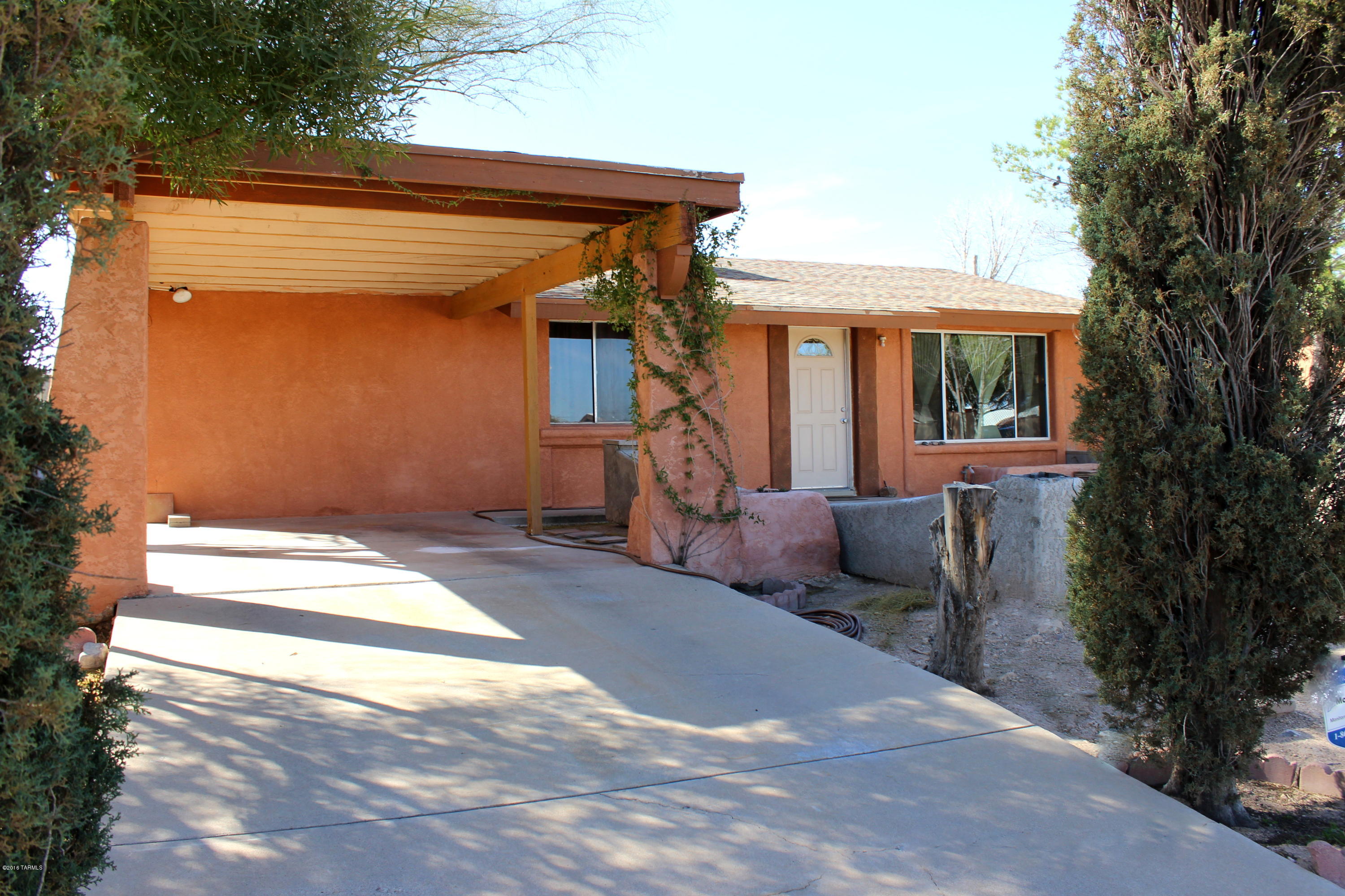 This home on a quiet street has easy access to I-19 and I-10, public transport, shopping and entertainment, and schools. Several upgrades have been done to this property. Large, easy care yards, and pretty tile throughout. Arizona room for added office or living space. Large yard for pets or entertaining. Perfect for owner occupied or rental property. Hurry at this price!