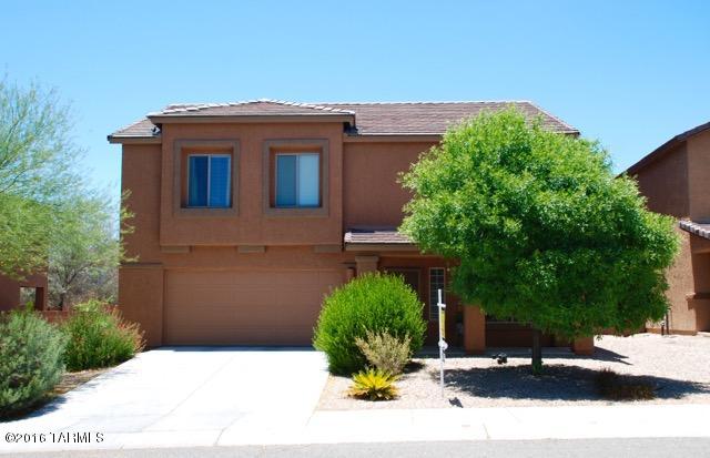 Come see this spacious 4 bedroom, 3 bath home with a large loft & plenty of upgrades in a great NW location! This is the largest floor plan offered by DR Horton in Cortaro Crossing at 2529 sq ft.! This wonderful home has a separate living room that flows into the family room, dining area & kitchen. First floor has extended ceilings for a spacious & open feel. Kitchen has upgraded cabinetry, granite counters, & a walk in pantry. The large loft upstairs has views of the mountains. Private & roomy master suite with corian topped dual vanities in the bathroom & walk-in closet. Hall bath has upgraded cabinetry with corian counters & bath surround.  All electric, TEP Guaranteed home with dual zoned AC units.  Covered patio in yard. This neighborhood is convenient to shopping & the freeway.