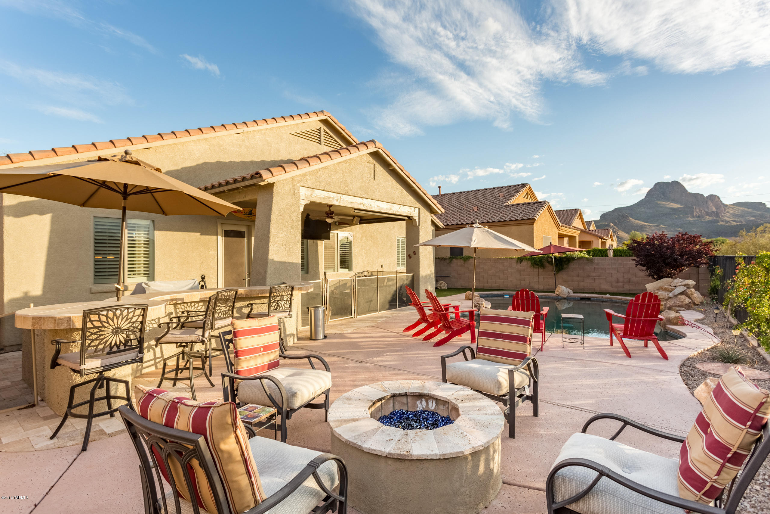 Absolutely stunning and immaculate home located in desirable Continental Reserve!This Lennar built, popular floor plan features 3 large bedrooms, 2 baths &  great room concept floor plan. The kitchen boasts maple cabinets, corian counters w/ custom backsplash stainless appliances, newly extended custom cabinets w/butcher block and built in kegerator. The backyard is an entertainers dream w/pebbletec pool (2013) with waterfeature, built in bar, firepit and covered patio! Sombrero Peak views & no rear neighbors complete this perfect package!Contact Co agent with all questions
