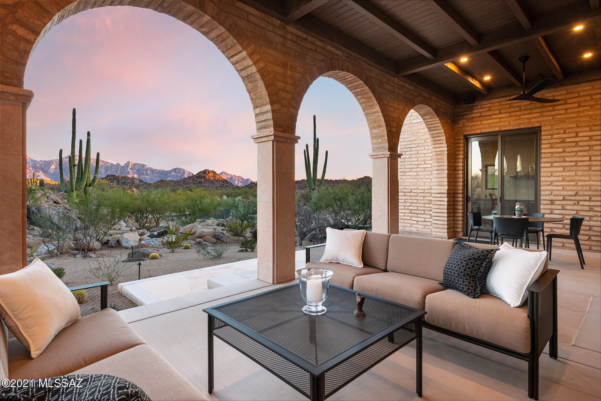 Spanish Colonial Adobe designed by award-winning architect, Clint Miller, situated on one of the finest lots in gated Stone Canyon w/breathtaking views in every direction, including sweeping views of both the Catalina & Tortolita Mountains, as well as intimate views of the rock croppings & abundance of saguaros on the property itself.  Built in 2019 the home offers both a sense of grandeur & intimacy. 3,828sf w/2 Master Suites each w/wood-burning fireplaces & walk-in closets. 1BR guest casita w/private entrance. Connected to Living-Dining room through an adobe arch, Kitchen features luxury appliances, honed granite counters & marble backsplash. Embracing the adage ''less is more'' the light-filled interior is simple & elegant, having an open, uncluttered feeling w/clean lines & contemporary sensibility w/walls of exposed adobe brick, adobe arches, selective earthen plaster walls & windows capturing the surrounding desert landscape.
