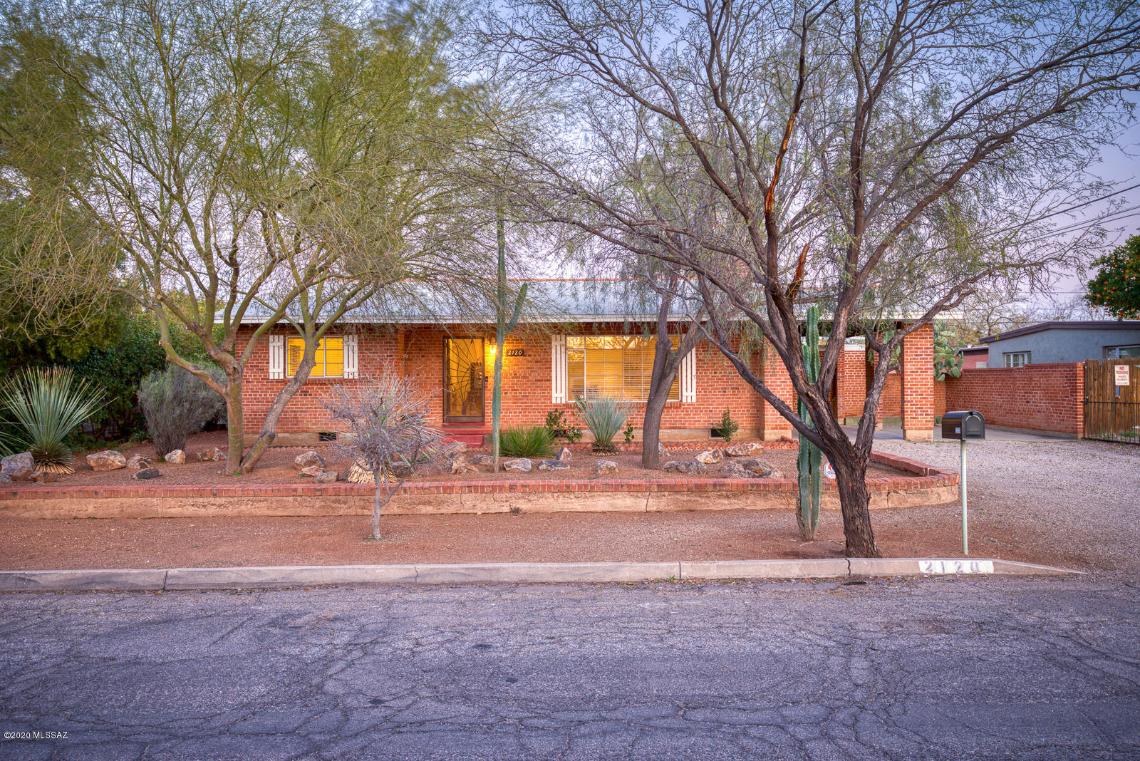 Classic wire cut brick ranch home in the historic Catalina Vista neighborhood. Updated and beautifully maintained. Hardwood and polished concrete floors. 2 great living spaces on opposite sides of the home. 3 beds with updated baths that show off period tiles. Granite counters and stainless/black appliances in kitchen. Updated laundry facility on property. Large, private back yard is perfect for entertaining. Great central location close to UofA and Banner Medical Center. Walking distance to Culinary Dropout, Postino and Snooze. This property has a historic tax designation.