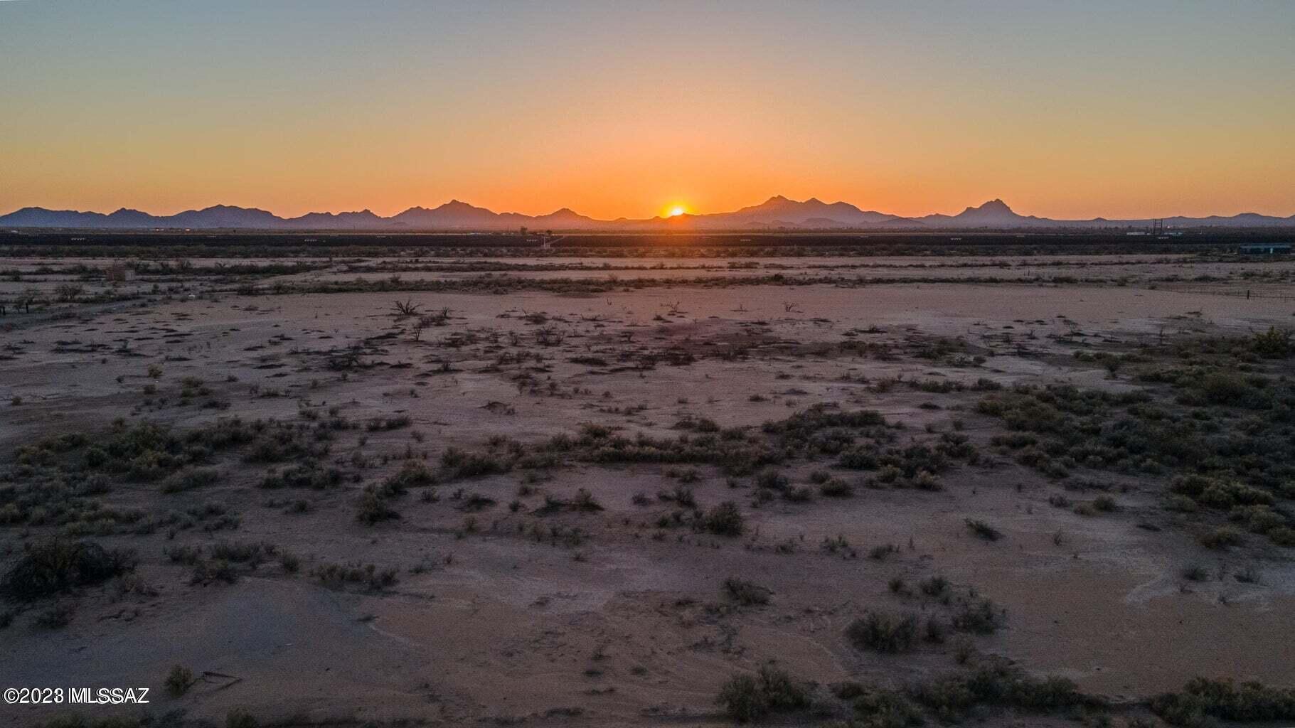OWNER Financing Available! This is Five 4+ acre parcels offered as a package. Rural living but with the convenience of shopping and restaurants less than 20 minutes at Arizona Pavilions.  Enjoy the solitude, Sunrises and Sunsets. Owner is willing to carry with 25% down.