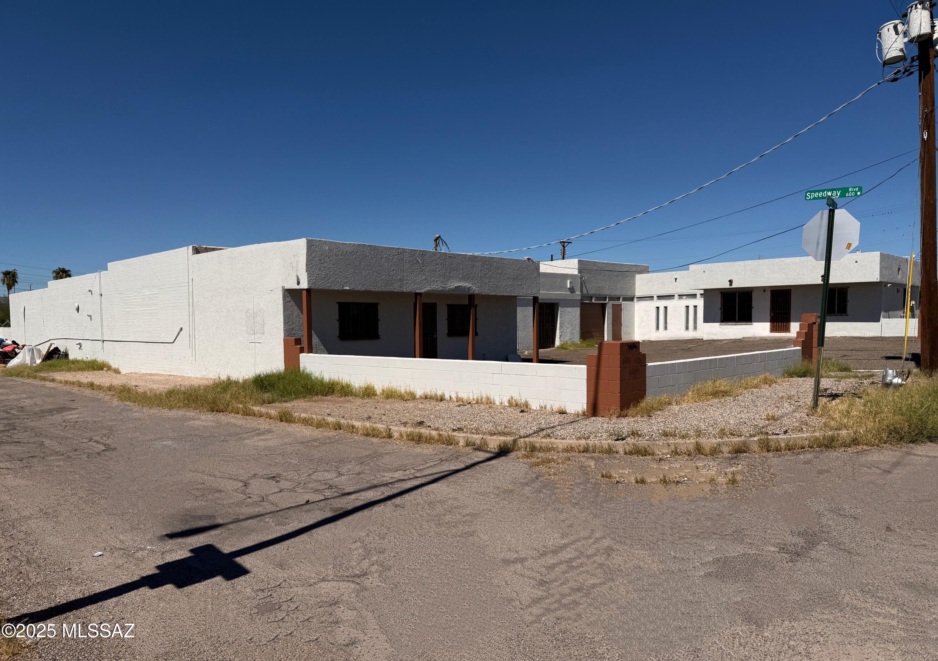 Calling all Gem Show investors & exhibitors, tile or cabinetry stores! Motivated Seller is offering Seller financing with attractive terms!  Prime C-3 zoned property offers 11,774 SF across six connected units on .62 acres. Keep them open or add dividing walls for multiple tenants. Mix of showroom, office, storage, and industrial space with standard and oversized roll-up door. Previously a huge tile store, ideal for Gem Show vendors, tile and stone suppliers, or light industrial use. Gated in back for security. Just one block from the Gem Show corridor, minutes from downtown and I-10, unbeatable visibility and opportunity!