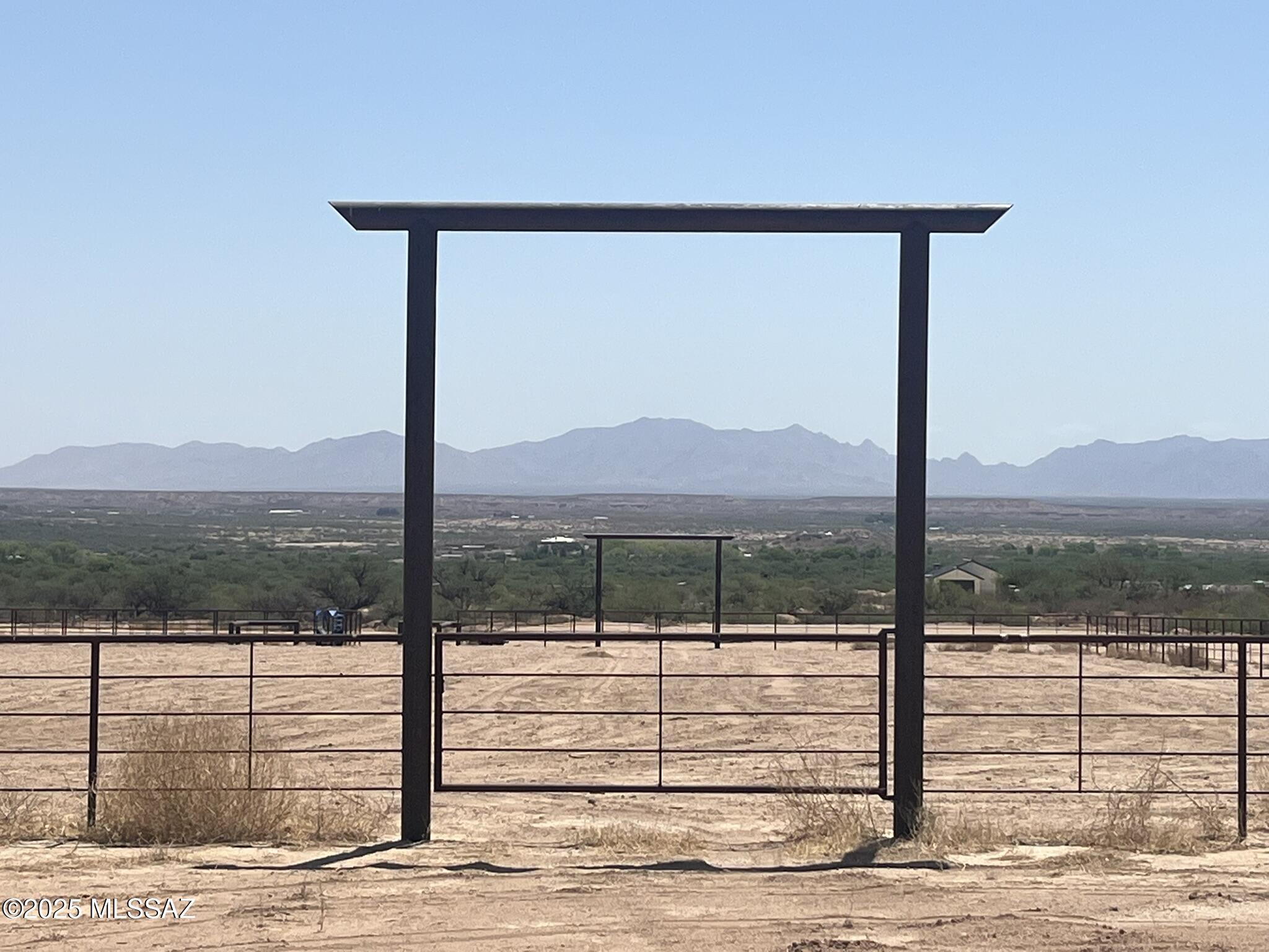 38 Acres located in Benson AZ with 1/4 mile of Highway 80 Frontage and a 285'x165' Roping Arena. The property is zoned Commercial (B2 zoning), and offers a Large Equipment or Hay Barn, large professional roping arena with large sorting pens, a high volume (75 gallon per minute) well, 3000 gallon tank, water stand, 400 Amp electric service and many acres of leveled parking. This a great opportunity to make an income at work you enjoy. Seller financing possible. Co listed with Scott Thacker, Stronghold Ranch RE. Owner is a licensed Real Estate Broker in AZ.