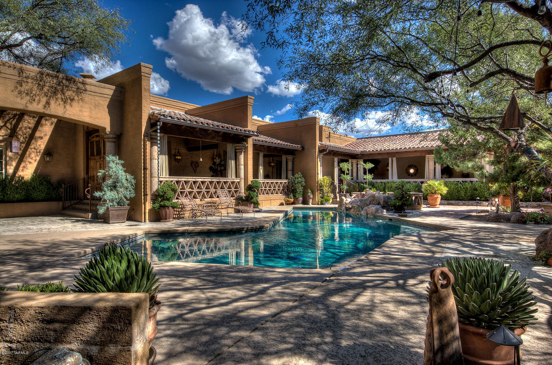 One of the most beautiful homes in Tubac,AZ.You will feel the tranquility and flow of energy that define this home and surroundings. Close to Tubac and the Golf Course yet in a world of it's own. On 13.5 acres with large courtyard, pool enclosed by veranda seating. Cantera flooring inside and out. Secluded patio dining area off kitchen. Horse property. Archaeological significant site. Solar auxiliary with propane and above ground gasoline storage.Stunning historic 1685 sq ft guest house.