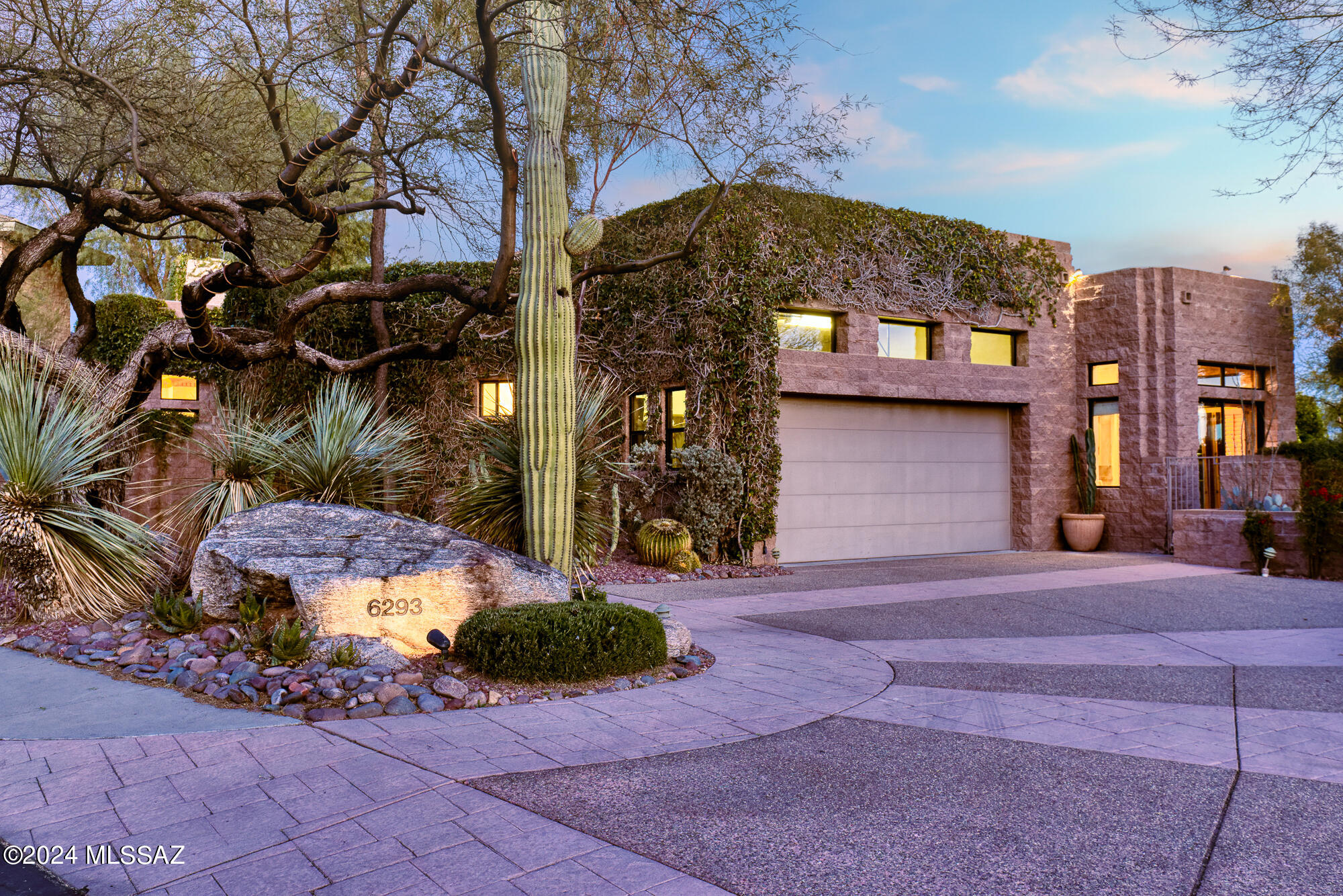 Nestled within the exclusive gated community of Ventana Canyon Country Club, this remarkable residence embodies luxury living at its finest. Designed by renowned architect Ron Robinette, the home boasts an impressive entry that sets the tone for the exquisite interior. Step into the fabulous great room, adorned with soaring 25-foot ceilings, creating an atmosphere of grandeur and elegance. With 3 substantial ensuite bedrooms and a library/office, each offering its own private patio retreat, this home effortlessly blends comfort and sophistication. Entertain guests in style with a formal dining area or gather in the spacious gourmet eat-in kitchen, perfect for culinary delights and casual gatherings alike. The primary suite is a true sanctuary, featuring expansive closets, (continued..) dual showers (including a luxurious steam shower), a generous tub, and direct access to a private outdoor spa, providing the ultimate in relaxation and rejuvenation. Outside, the main rear yard beckons with an inviting swimming pool, offering panoramic views of the lush golf course and majestic surrounding mountains. Experience unparalleled luxury and tranquility in this exceptional desert oasis.