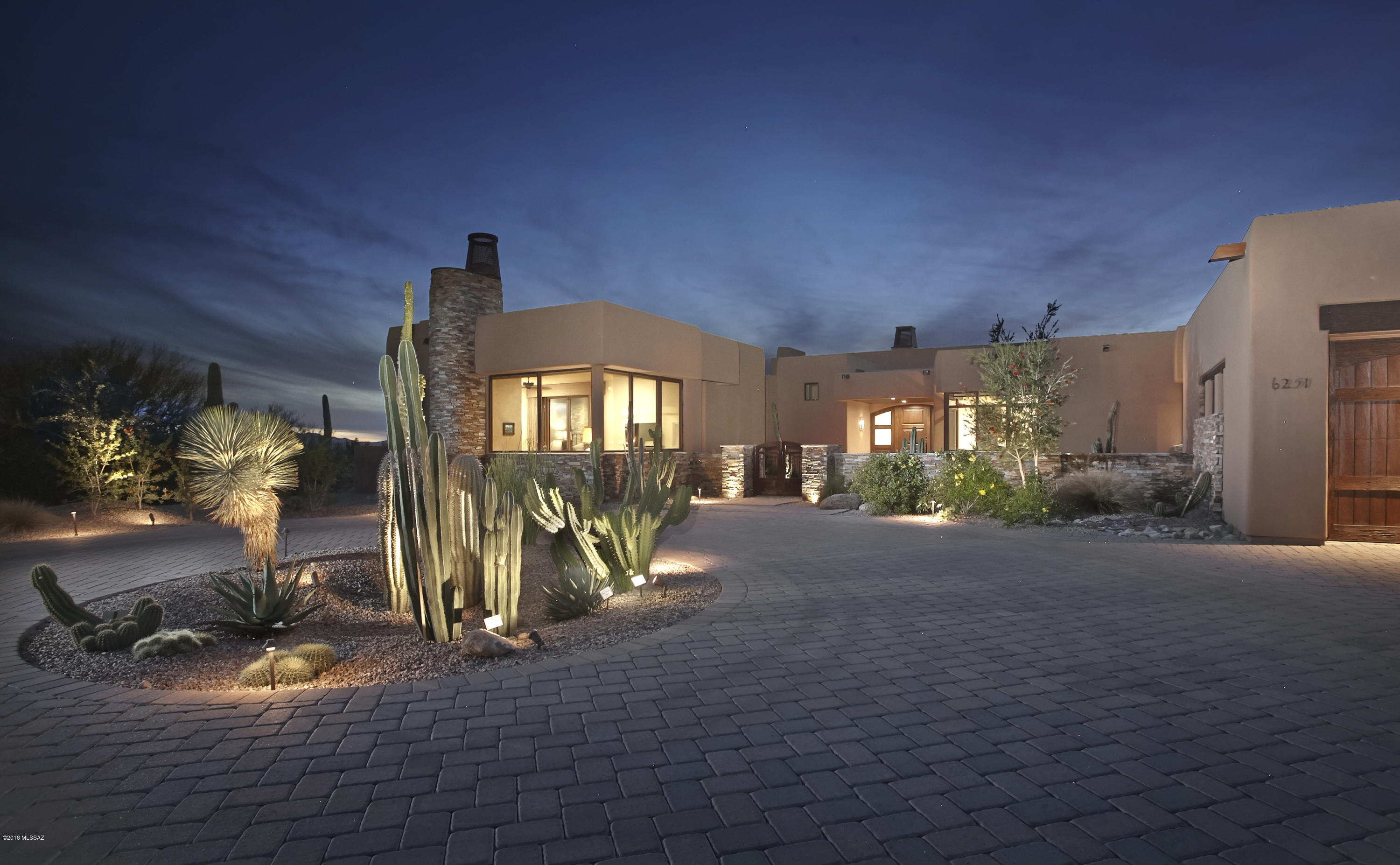 Drastic Price Reduction & now PRICED TO SELL! Managed, serviced & branded by The Ritz-Carlton, life here is a permanent vacation at a 5 Star Luxury Golf Resort in a desert setting unmatched in the Southwest. This spacious one level 3 bedroom + den/4ba home was designed for entertaining & features a large living room w/gas fireplace & exposed beams, retractable walls of glass, a wet bar w/Onyx countertops, hardwood flooring, a walk in wine cellar & a true gourmet kitchen w/Wolf appliances, granite counters & custom cabinets. The rear terrace features a gas firepit w/Banco sitting, built in grill, rolling automatic shades & the most magnificent sunsets. The spacious 1br/1ba guest house completes the package . Ideal for a luxury seasonal, vacation or year round residence.
