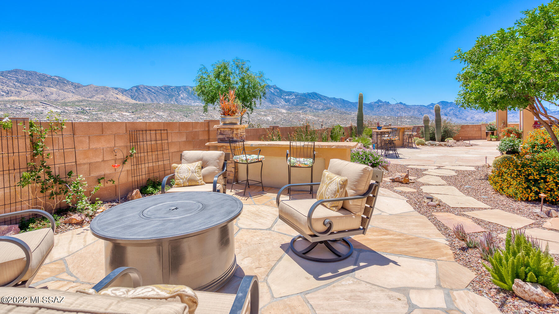 Surrounded by panoramic mtn views, this territorial style Sonoran model in SaddleBrooke's Preserve has it all. Enjoy unobstructed mtn views from private courtyard. Entering the house, a spacious great room has a wall of glass overlooking the mtns & is open to spacious kitchen & dining. Through the Butler's Pantry is the formal Dining Room/Gathering Space w great views. Private den/office w lighted built-ins & views. Guest suite has private bath. Owner's Retreat w incredible mtn. views has en-suite w/ walk-in shower, soaking tub, double vanities & large walk-in closet w access to laundry. + 3 car garage. Private guest casita w bath, tile throughout except in Owners + 3 car garage. Large covered patio w electric sun shades, expanded flagstone entertainment areas & unobstructed mtn views.