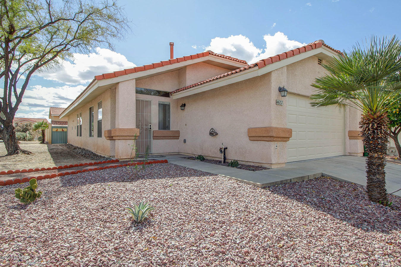 Convenient NW location, easy access to Interstate, shopping, schools & restaurants, this light, bright 3 bedroom, 2 bath home is ready for it's new owners. Split bedroom plan, NEWLY painted interior, NEW garage door, updated lighting, updated master bath, NEW wood-look tile, NEW window blinds, NO Polybutylene piping-replaced 2015. Corner lot with additional parking. Covered patio with 2 ceilings fans, private back yard with extended patio and nice lemon tree. Clean garage with shelving, workbench & ceiling fan. Vaulted ceilings in living room, dining & kitchen. Ideal home for small family, couple or single ~ move in ready. Don't miss this one ~ Please call for your private showing today.