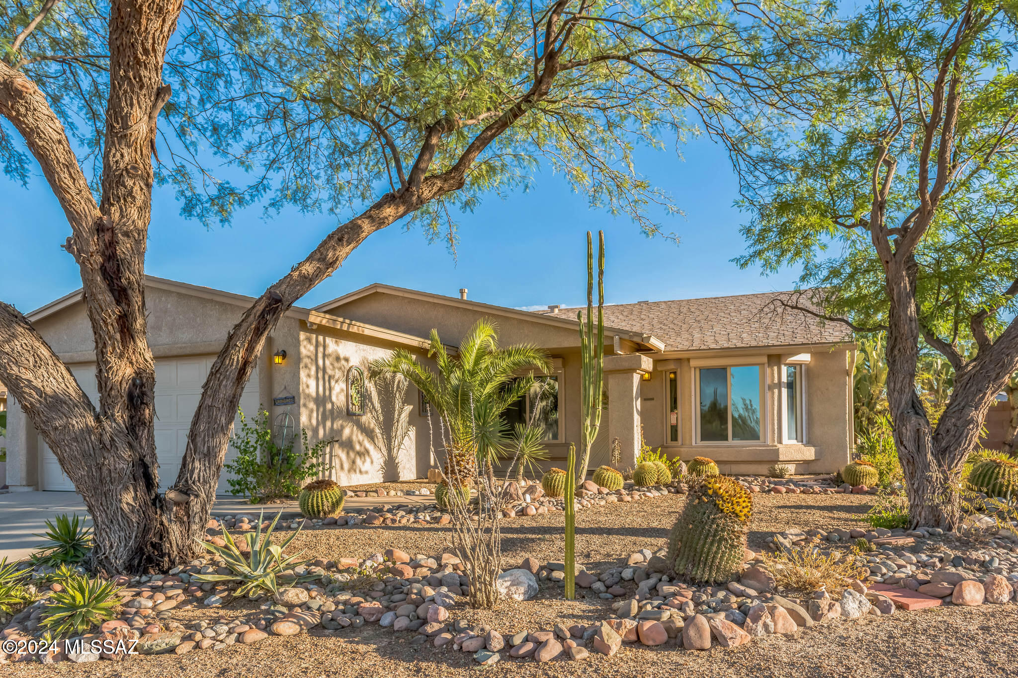 Come see this beautiful 4-bedroom, 2-bath home in Macalester Park, perfectly situated on a corner lot just steps away from the community pool. With a newer HVAC and roof, this home is move-in ready. Ceramic tile runs through the common areas, and the backyard boasts breathtaking views of the Catalinas. Unique murals in the backyard capture the vibrant culture of Tucson, seamlessly blending with the mountain views for a truly picturesque setting. So many updates to see and appreciate—don't miss out!