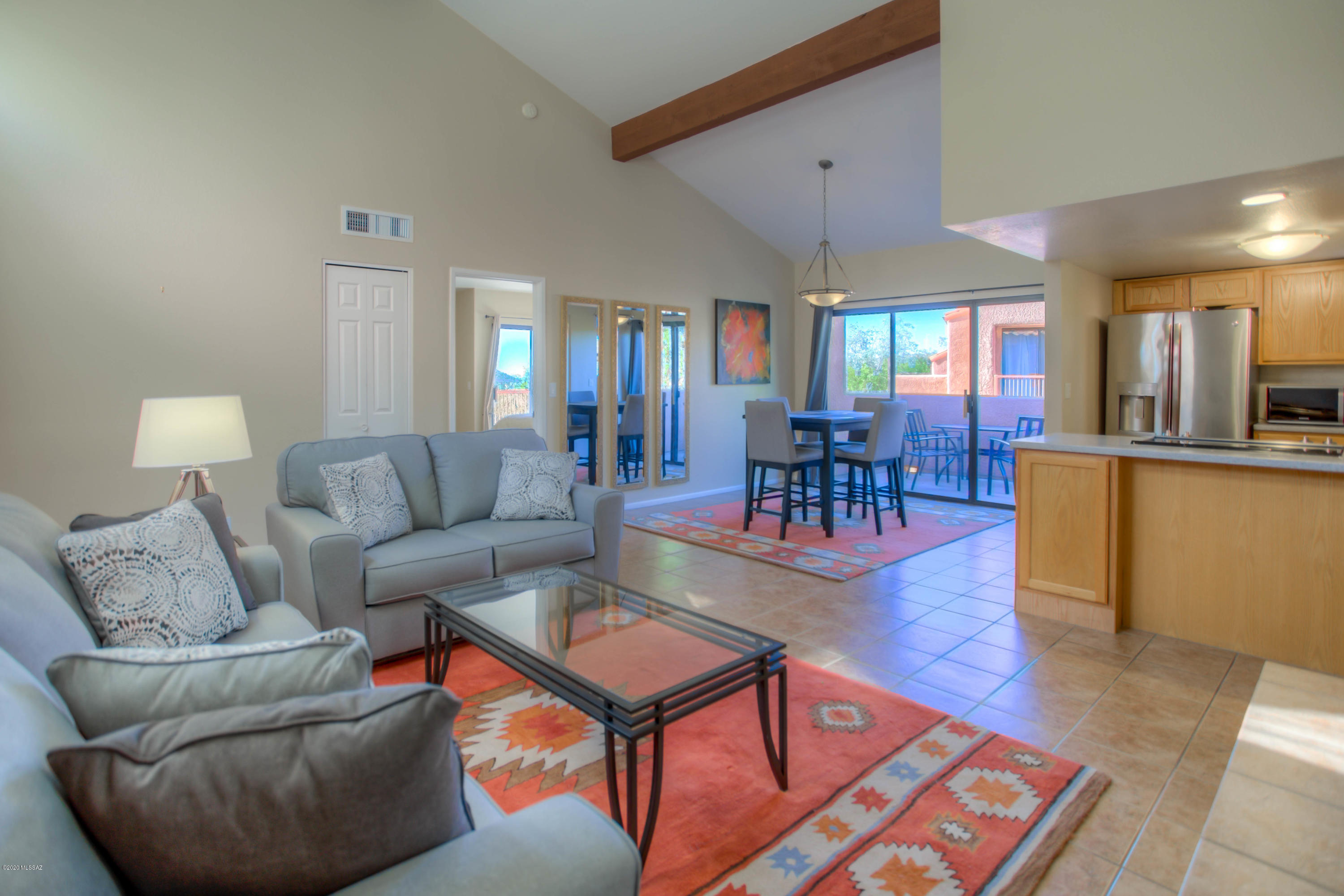 Welcome to your private retreat in the desert!  Just one mile from Sabino Canyon Recreation Area, this stunning home features a bright and open Great Room with vaulted ceilings, split bedroom floorplan, laundry closet with washer/dryer, kitchen with stainless steel appliances and Corian countertops, spacious Primary Bedroom with a large ensuite bathroom, walk-in closet and one of two scenic balconies!  Venture out to the second balcony off of the Dining Area to enjoy gorgeous sunsets and city views!  The gated community amenities are endless, including BBQs, Rec Center, pool, spa and tennis! Pickleball is an activity frequently enjoyed by the community! This is an upstairs unit, the interior is all one level.  Be sure to take our 3D Walkthrough Tour!