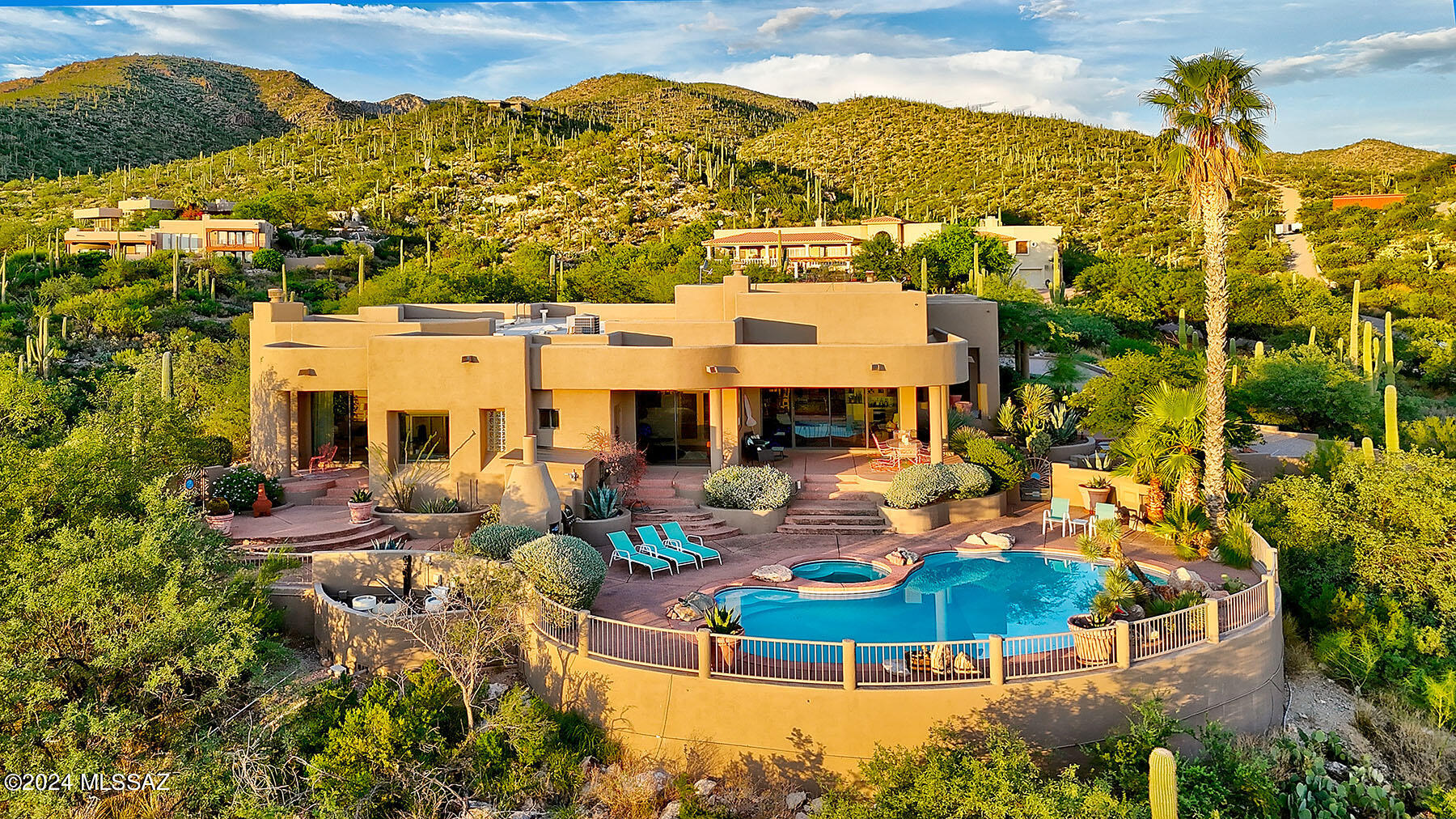 This desert oasis home is nestled in the serene and picturesque Redington Ranch. The exquisite luxury property offers unparalleled views and an array of high-end amenities. Spanning approx. 2.95 acres of beautifully landscaped grounds and natural desert, this home is a true haven of comfort and elegance. 4 beds, 3 baths, stunning pool with panoramic views, spa, private sauna with unobstructed views of the Catalinas, Rincons and city lights. Multiple patios and outdoor dining areas. All your infrastructure needs are met with 2 new HVACs (2023, 2024), water heater (2023), roof recoated (2023). The outside of the home has been completely painted. Community amenities include horse facilities, pool, clubhouse, tennis/pickleball court.