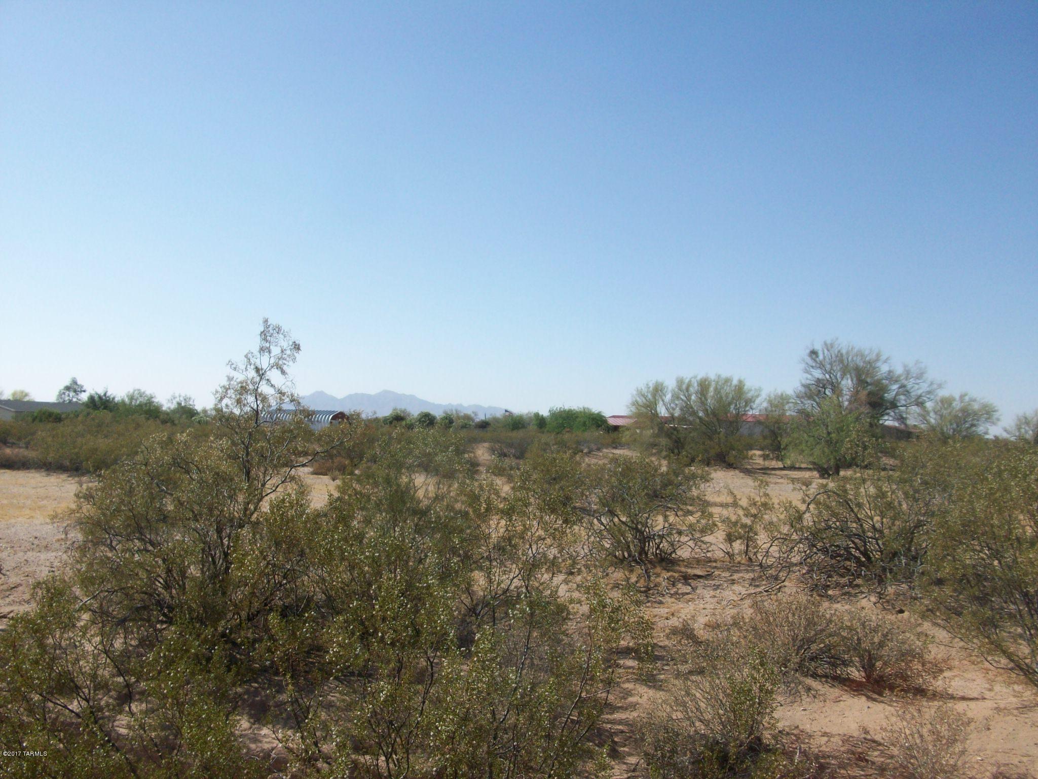 5 beautiful acres of natural desert - just down from paved road.  Privacy plus a few neighbors to make it a pleasure to live in the area - manufactured or site built - perfect place for ''Mini Farm''