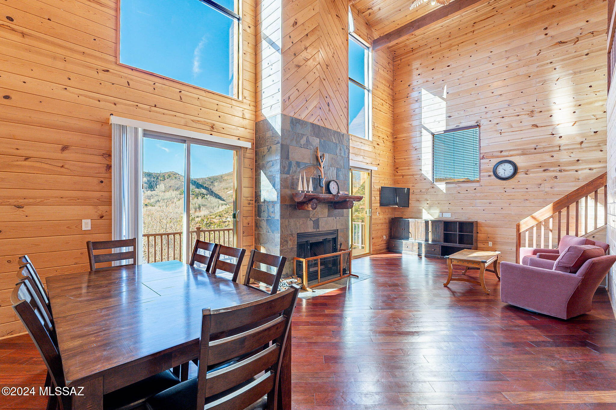Charming large cabin located on Mount Lemmon has year round access to enjoy all the seasons! This 2,378 sqft 4 bedroom 3 bath cabin being sold furnished, sits on a 5,193 sqft lot. Inside features beautiful cherry wood floors, travertine ceramic and slate tile and tongue and groove walls and ceilings. Large mud room with a washer, dryer and trash compactor. Great for storing all your hiking boots and ski gear! Gourmet kitchen with stainless steel appliances and beautiful granite counter tops. Cozy fireplace in the spacious great room to keep you warm in the winter months. Bedroom on main floor with its own private deck to enjoy the early morning views. 3/4 bath on main floor with a walk-in in shower with a built in bench and beautiful granite counter tops. Upstairs has 2 bedrooms that have their own private decks as well and 3/4 bathroom with a walk in shower. Downstairs basement leads to two rooms, one with a full bath and storage closet. The other has two storage closets and a large concrete patio to enjoy the lovely mountain views. This beautifully designed spacious cabin is a must see, don't miss out on your dream cabin!