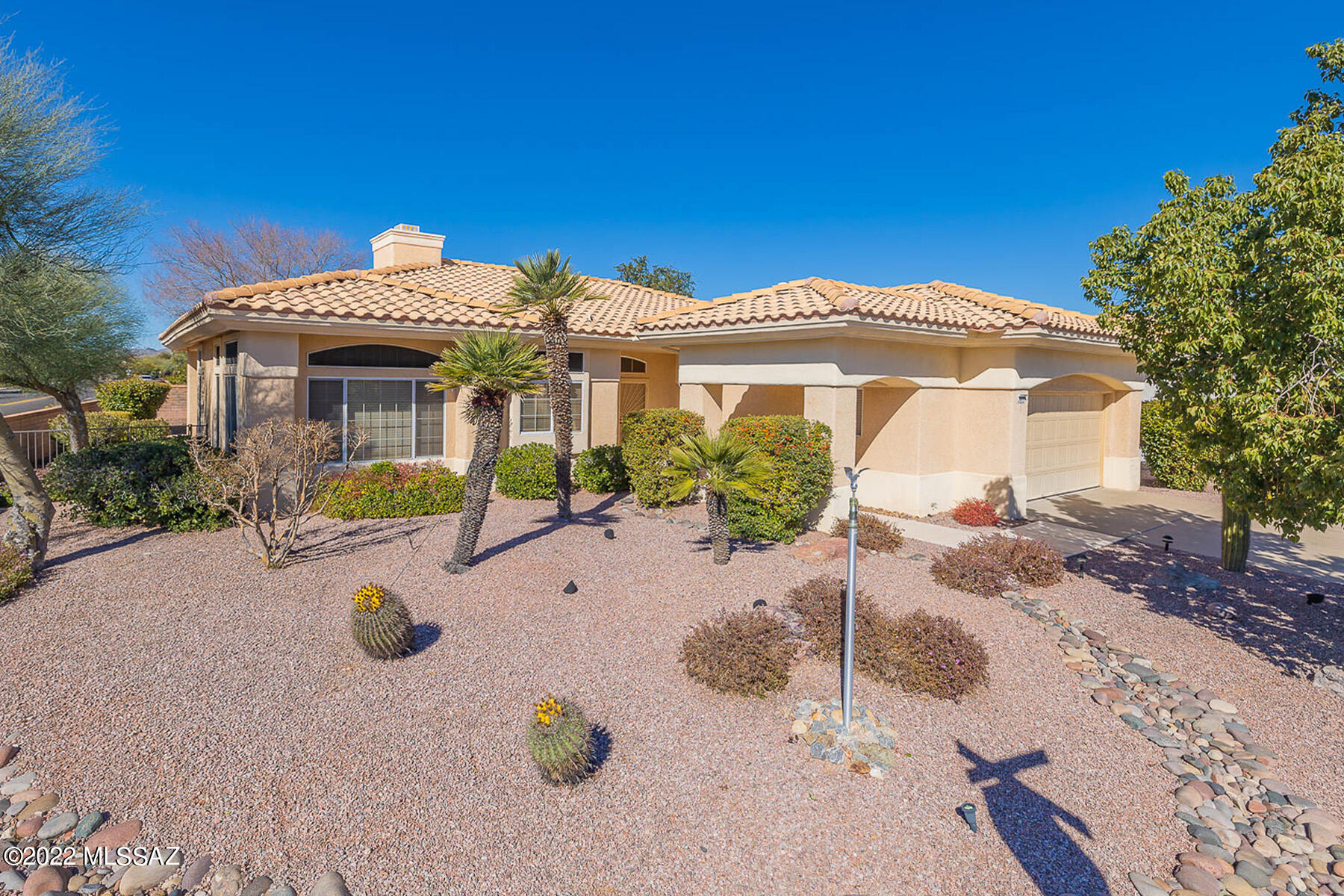 Cozy 2BD/2BA (1,858 sq ft) home in Sun City Oro Valley on corner lot featuring beautiful Catalina views! Enter through double security doors into the foyer. Living Room hosts built-in entertainment center and gas fireplace. Kitchen features center island, electric cooktop, in-wall oven/microwave plus built-in desk. Large breakfast nook boasts wall to wall windows and grand views of the Catalina Mountains! Master suite hosts double door entry, dual vanities, a soaking tub plus walk-in shower & huge closet w/ built in storage. Spacious guest bedroom has double door entry and 2 closets. Two car garage hosts ample built in storage. Rear covered patio hosts rolling screen shades for outdoor enjoyment. Sun City active adult community features clubhouse, golf course, pool, fitness center & more!