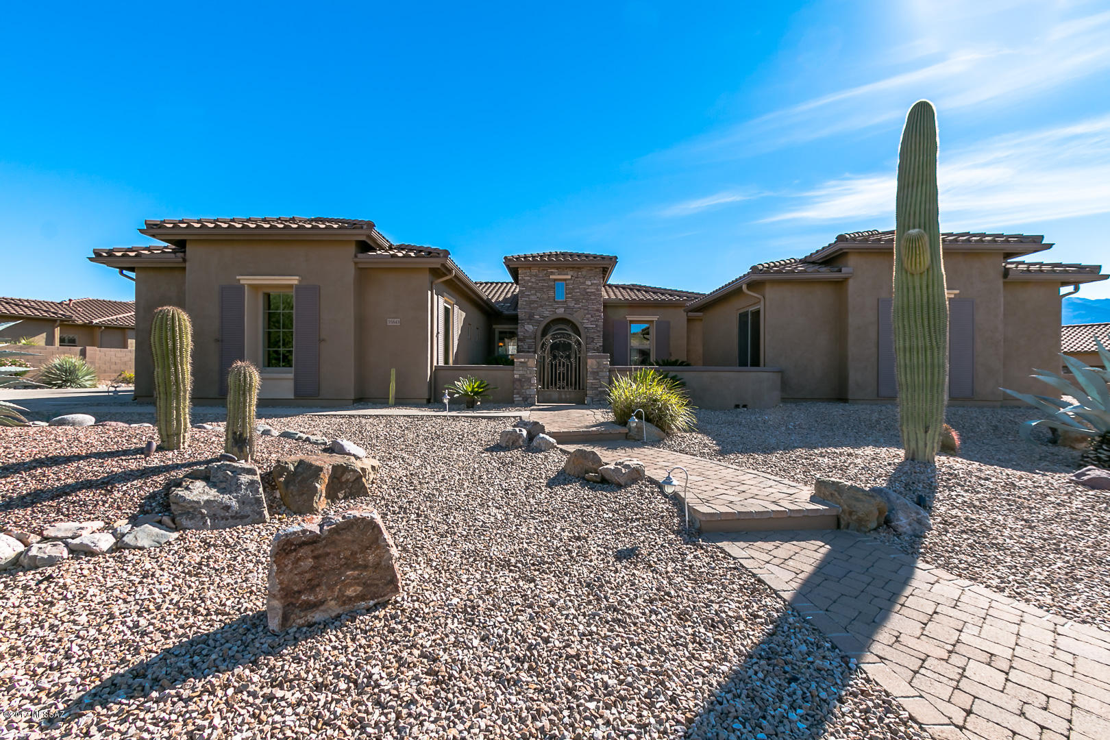Majestic mountain views! This stunning Tierra floor plan located in the SaddleBrooke Preserve, w/ views from nearly every room. Loaded w/ high end finishes, gorgeous kitchen w/cherry cabinets, granite countertops, Monogram SS built-in refrigerator, double oven, butler’s pantry w/ bar refrig/icemaker. Open great room w/gas fireplace, a wall of windows, & formal dining room. Master Suite w/ sitting area, walk-thru double shower, separate vanities & extra hobby room. Beautifully modified 2nd Br & bath. Lots of storage in the large 3 car garage. Custom 494-sqft Casita w/ kitchenette, SS fridge, granite tops & custom bath. Unbelievable backyard, two fire pits & waterfalls at sparkling solar heated pool; an exquisite setting, built in BBQ center w/FP & table. Seller is real estate agent in WA.