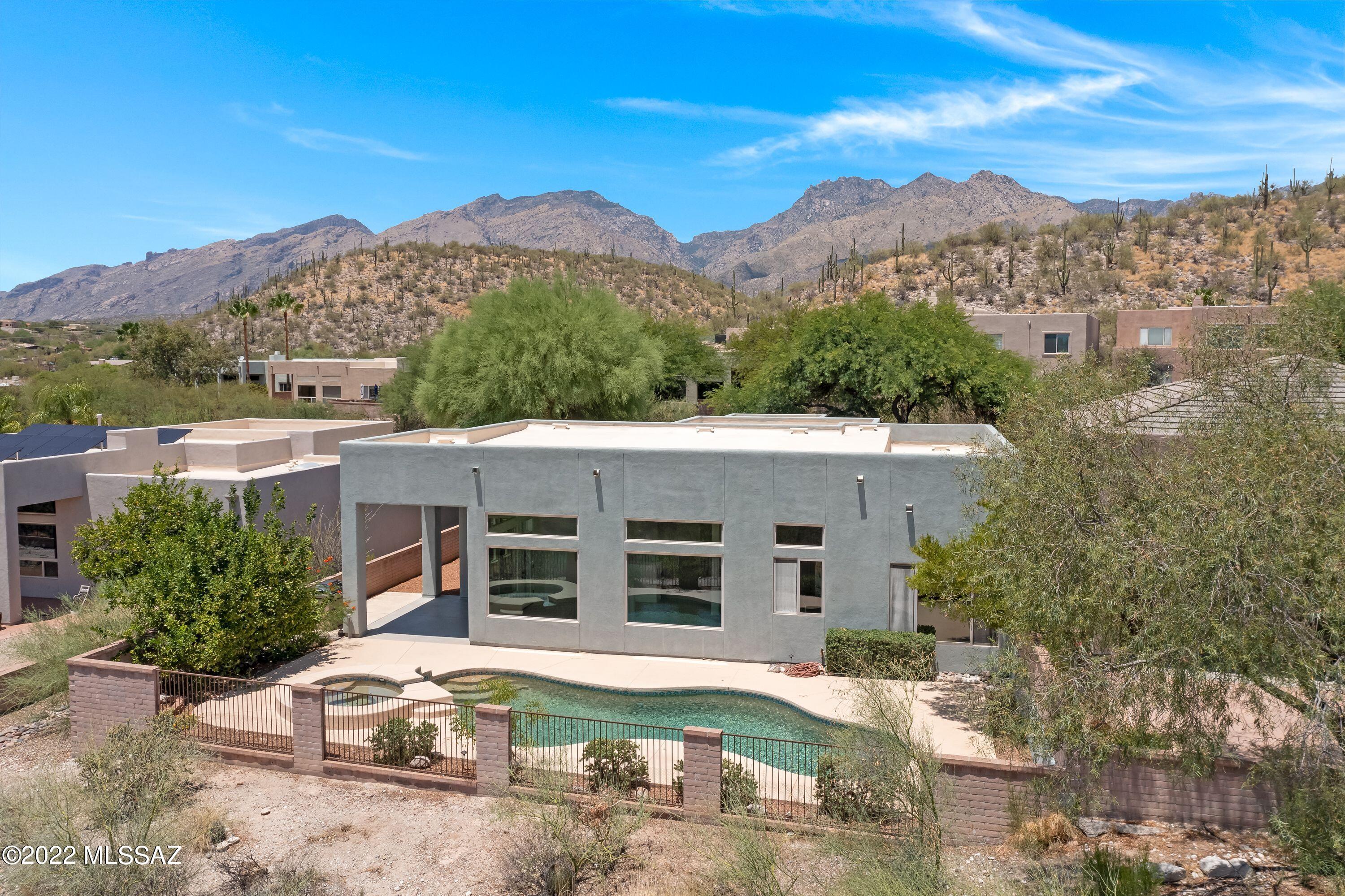 Wow!  A spectacular, move-in ready home with an attached 1 room, 1/2 bath studio guest house in gated Bonita Ridge subdivision with sparkling city views!  Located on a cul-de-sac street with no thru-traffic! Over $50,000 recently spent on upgrades!  Walls of windows make this home light, bright, & airy! Check out these upgrades!  Two brand-new Rheem air conditioning units for the main home!  New interior and exterior paint!  Newly coated roof and parapets sealed!  A new plate glass window!  Kitchen cabinets repainted + new kitchen faucets!  Two new toilets in the main home!  Two new skylights!  New exterior lights and irrigation system!  New smoke detectors! Plus a gas cooktop!  An American Home Shield warranty is in place!  What's not to love about this home!?  Hurry, it won't last long!