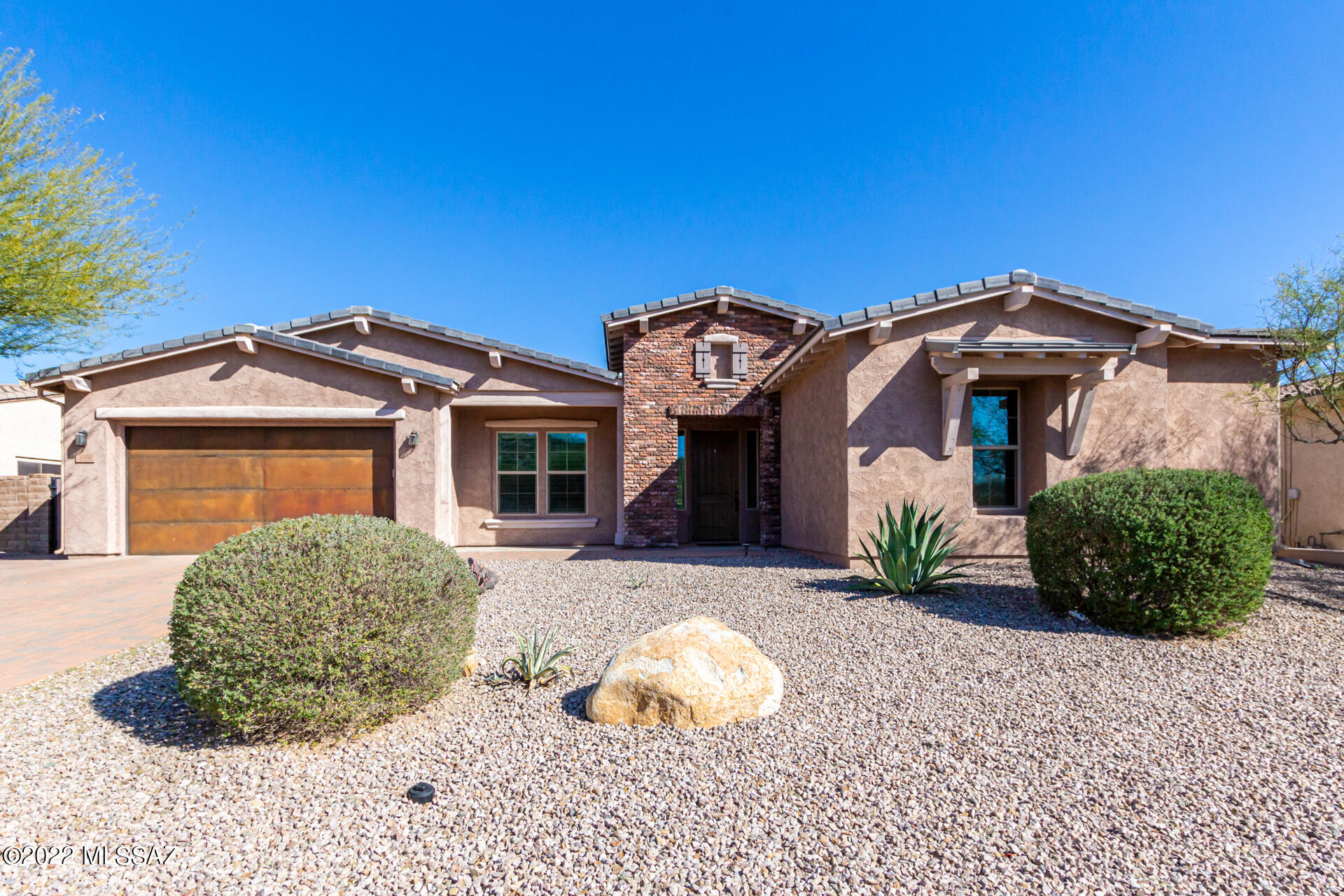 Discernibly maintained, 4-Bedroom, 4-bath Maracay Home, located in a quiet & gated Catalina Foothills community. This multi-generational home is move-in ready with many upgrades, exceptional finishes including low maintenance tile flooring throughout, an open great-room,  large welcoming kitchen equipped with stainless steel appliances, center island and granite countertops.  The 2nd owner's suite, with separate bedroom/bath, living room & washer/dryer hook-ups, can be use as multigenerational suite, private guest quarters, or a workout suite with attached sleeping quarters.  This home also has an office with newer custom cabinetry & built-in desks, formal dining room and mudroom both with newer custom cabinetry. Back yard with Catalina Mountain views, barbecue area and pavers. Come see it before it is too late.