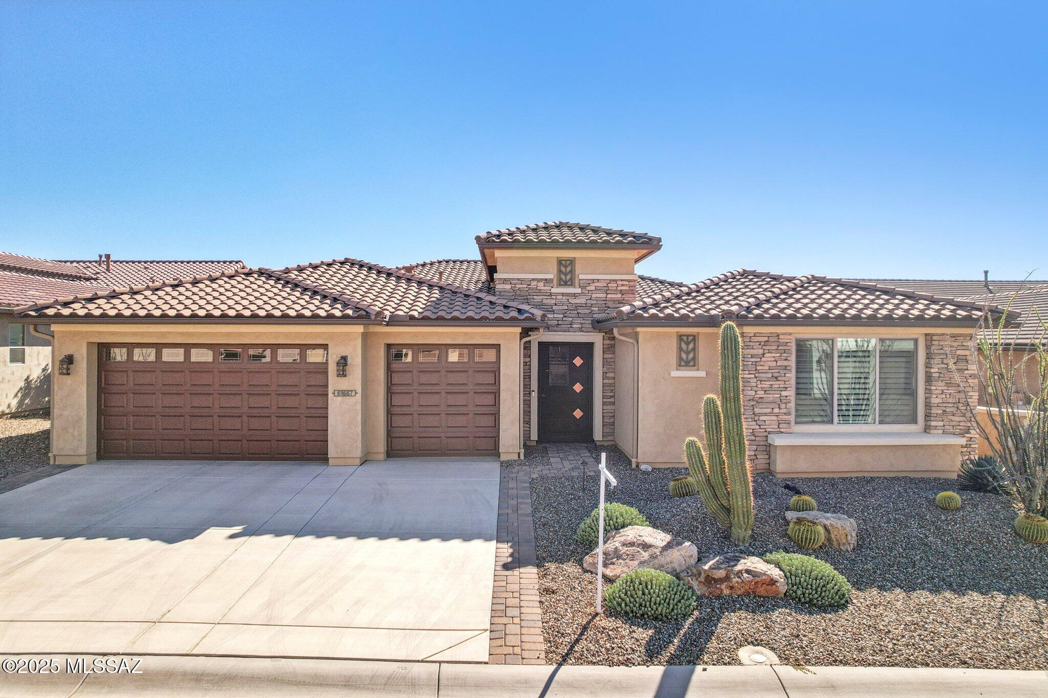 Views Views Views. The moment you step through the front door you are greeted with expansive desert views and unobstructed mountain views beyond. This highly upgraded home features the sought after Solstice floorplan with great room, spacious kitchen, and dining room all open to each other making it perfect for entertaining. Gourmet chef's kitchen features two tone cabinetry, built-in bar area with glass front cabinets, appliance garage, professional s/s appliances incl induction cooktop and microwave drawer. Large curved island with apron front sink, sit up bar and custom pendant lighting. Light and bright great room has contemporary style linear electric fireplace, display shelves, and surround sound system. Large Primary Suite features bay windows allowing for views and tons of natural light, huge walk in shower, double vanity with quartz counters, and custom walk in closet system. Additional bedroom features en-suite bath perfect for guests. Den has more custom cabinetry that features two work stations perfect to use for a home office plus additional storage and wall mount TV. Tile at entry and wood-like porcelain tile throughout main areas of home. Step outside to your private backyard backing to state land with covered patio, extended brick pavers, cactus fountain, low care landscaping and views for miles. Added bonus- Enjoy nearly free electric bills with owned solar. Custom wrought iron screen, 3 car garage, plantation shutters, whole house filtration system....the list goes on. Hurry this home with this view won't last long.